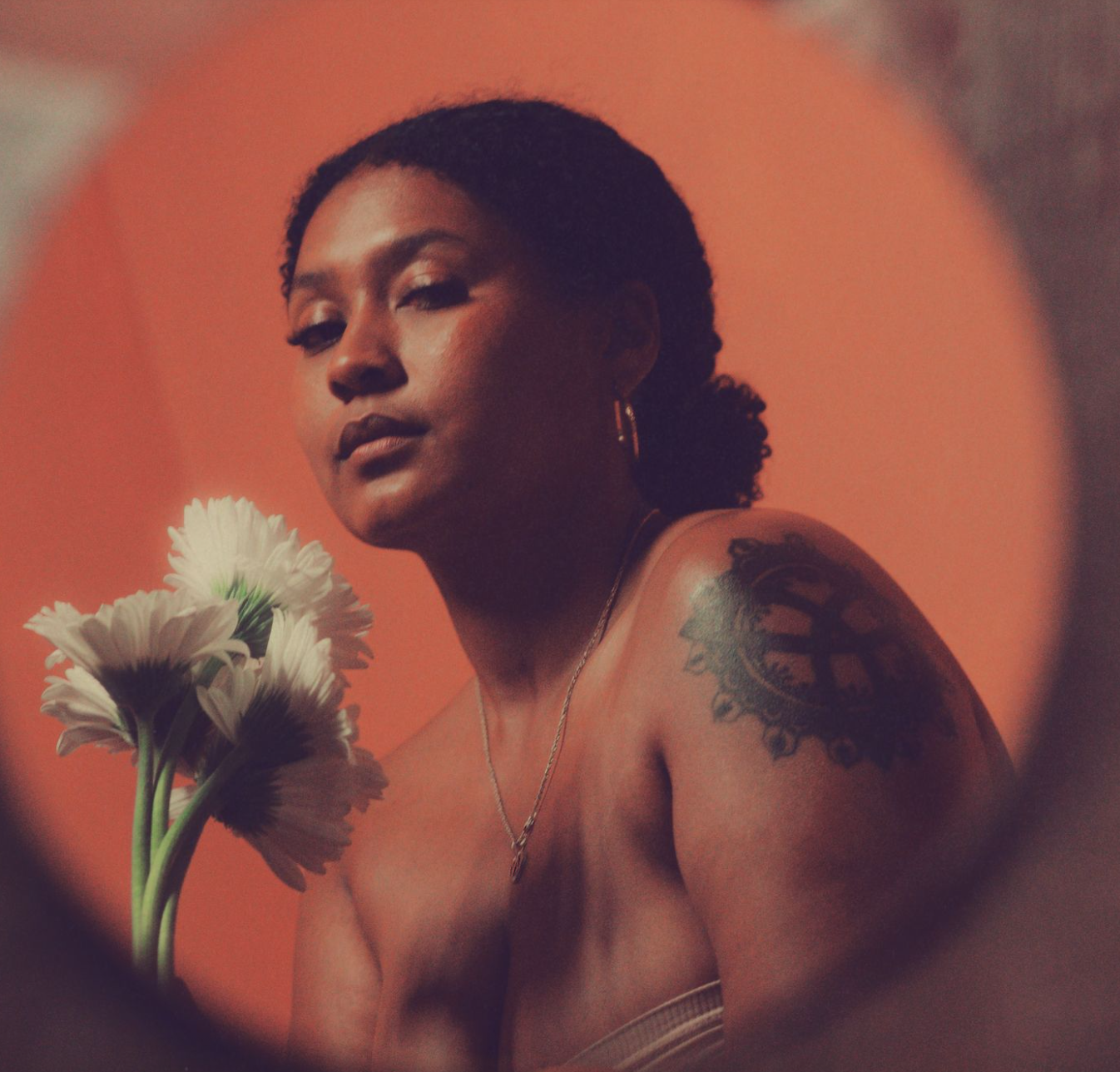 Contemplation
(30x40in):

The flower is held not for show, but for herself. She meets her own gaze, not seeking approval, but presence. 

The petals echo her softness, her ache, her memory. She is both the observer and the observed. Whole in her soli