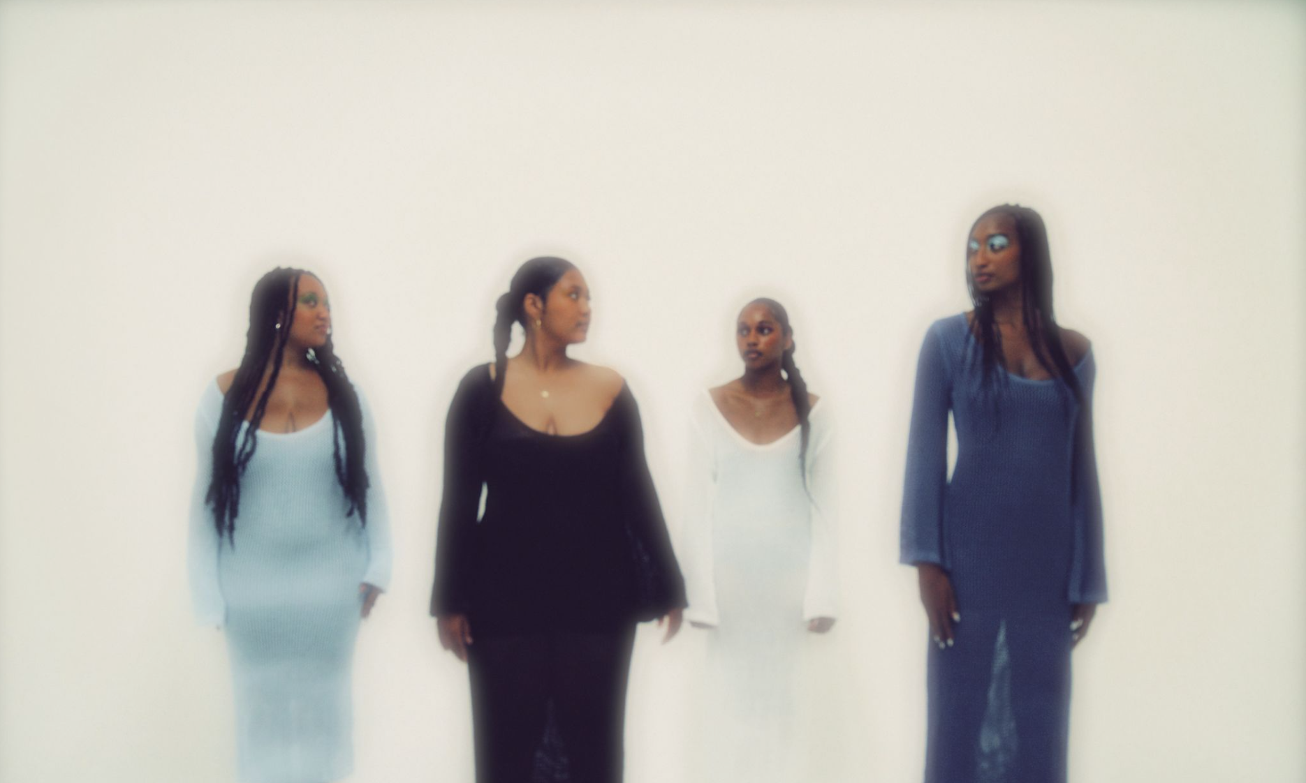 The Quiet Language of Women
(30x40in):

Four women dressed in hues stand closely together. Their gazes gently meet as if in quiet conversation. 

As if they are gracefully emerging out of the water, the subtle shimmer around them evokes a sense of re