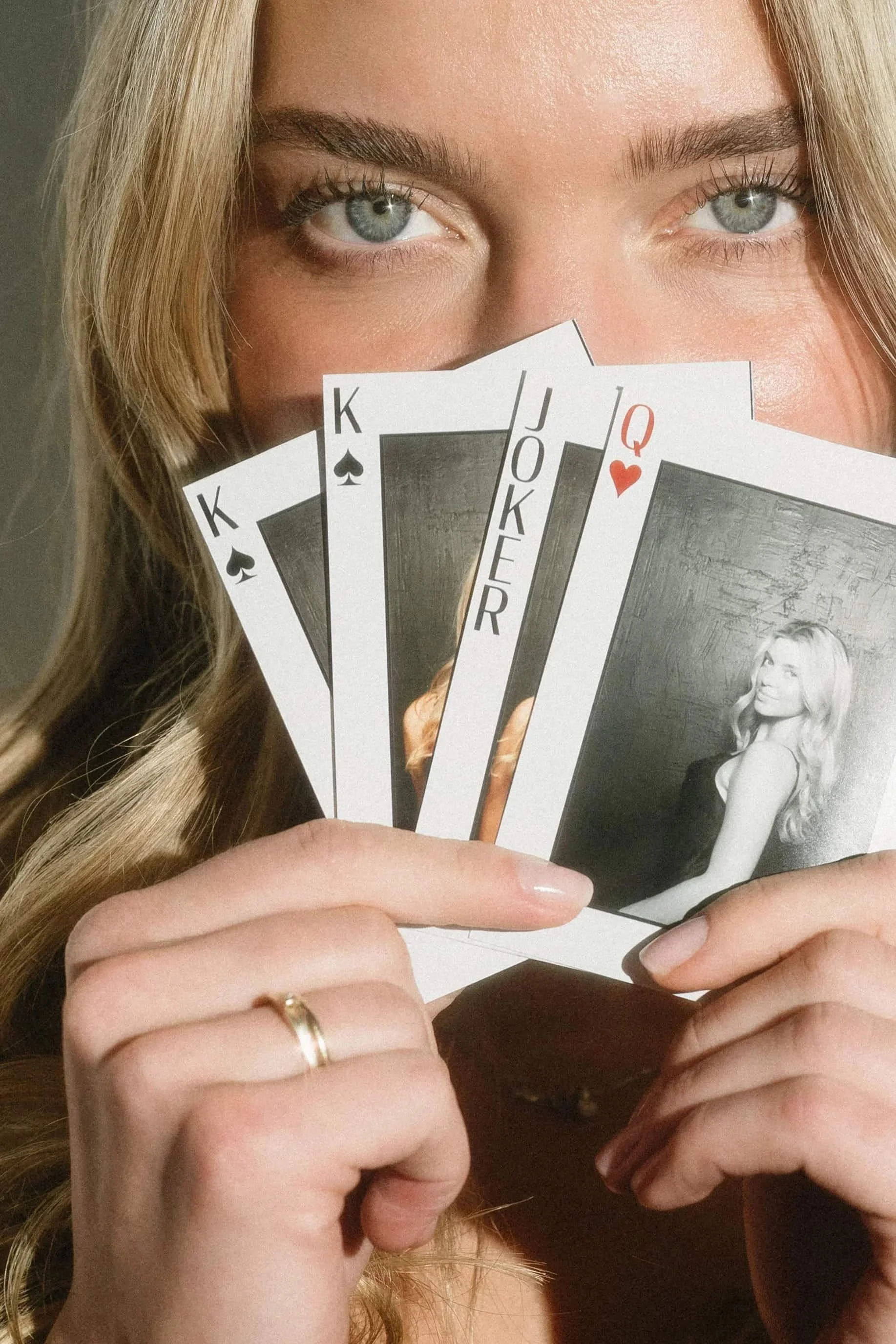 Guest Showing Her Poker Card Photos Taken By Perfect Capture Booth's Poker Photo Booth