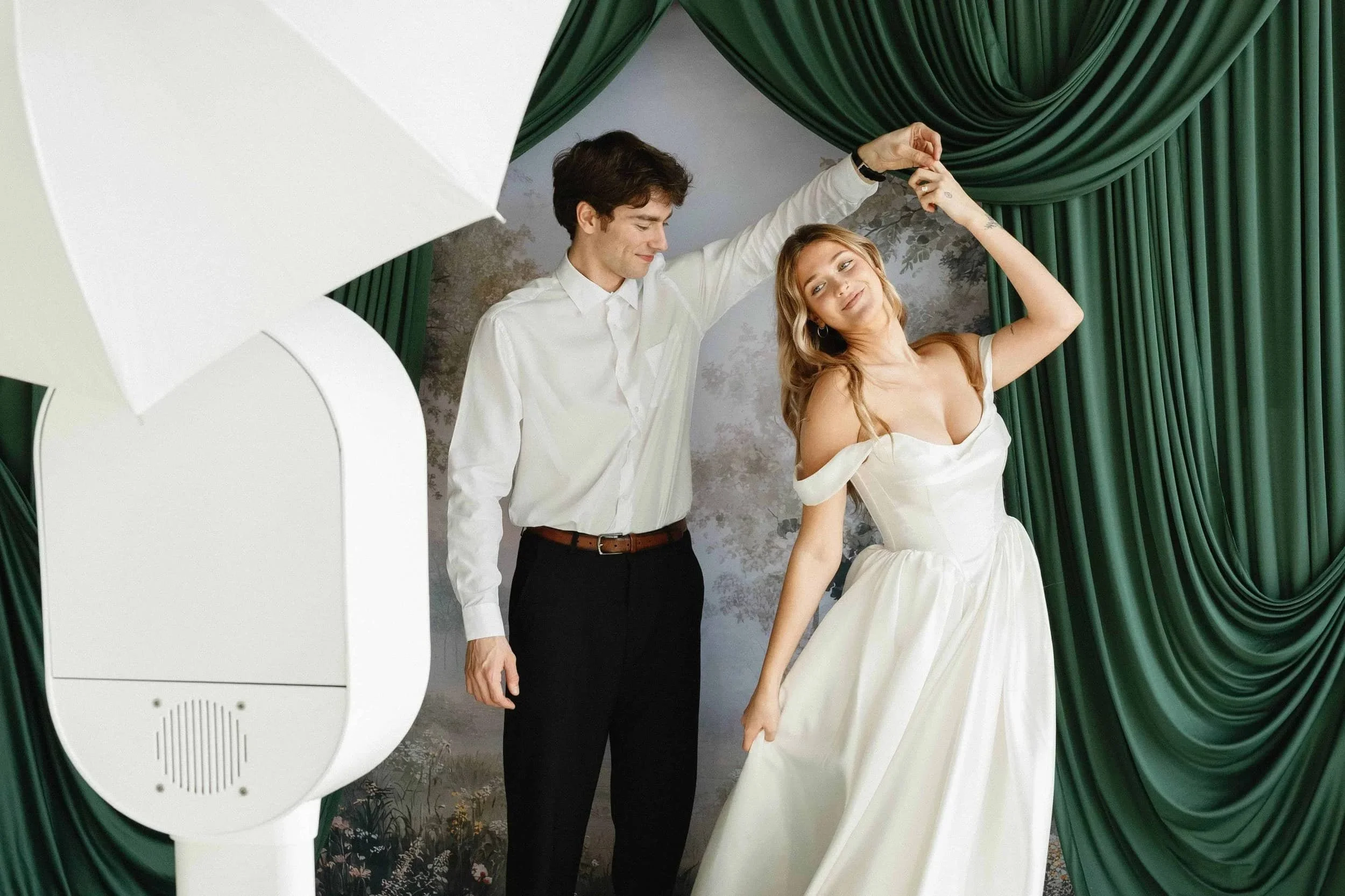 Wedding Couple Posing For Perfect Capture Booth's Studio Booth