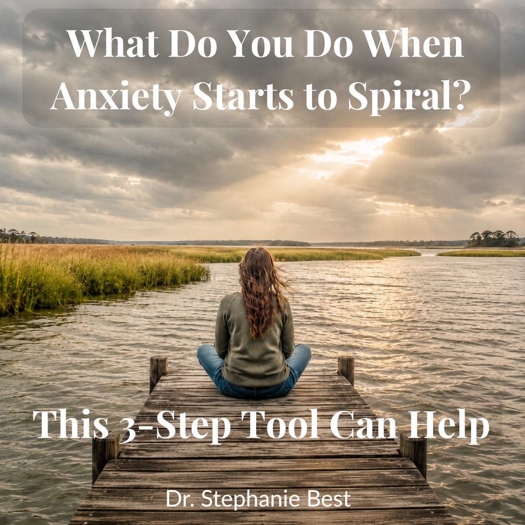 Woman sitting still on a weathered dock over a South Carolina marsh, sky stormy with light breaking through — dropping anchor ACT anxiety grounding exercise