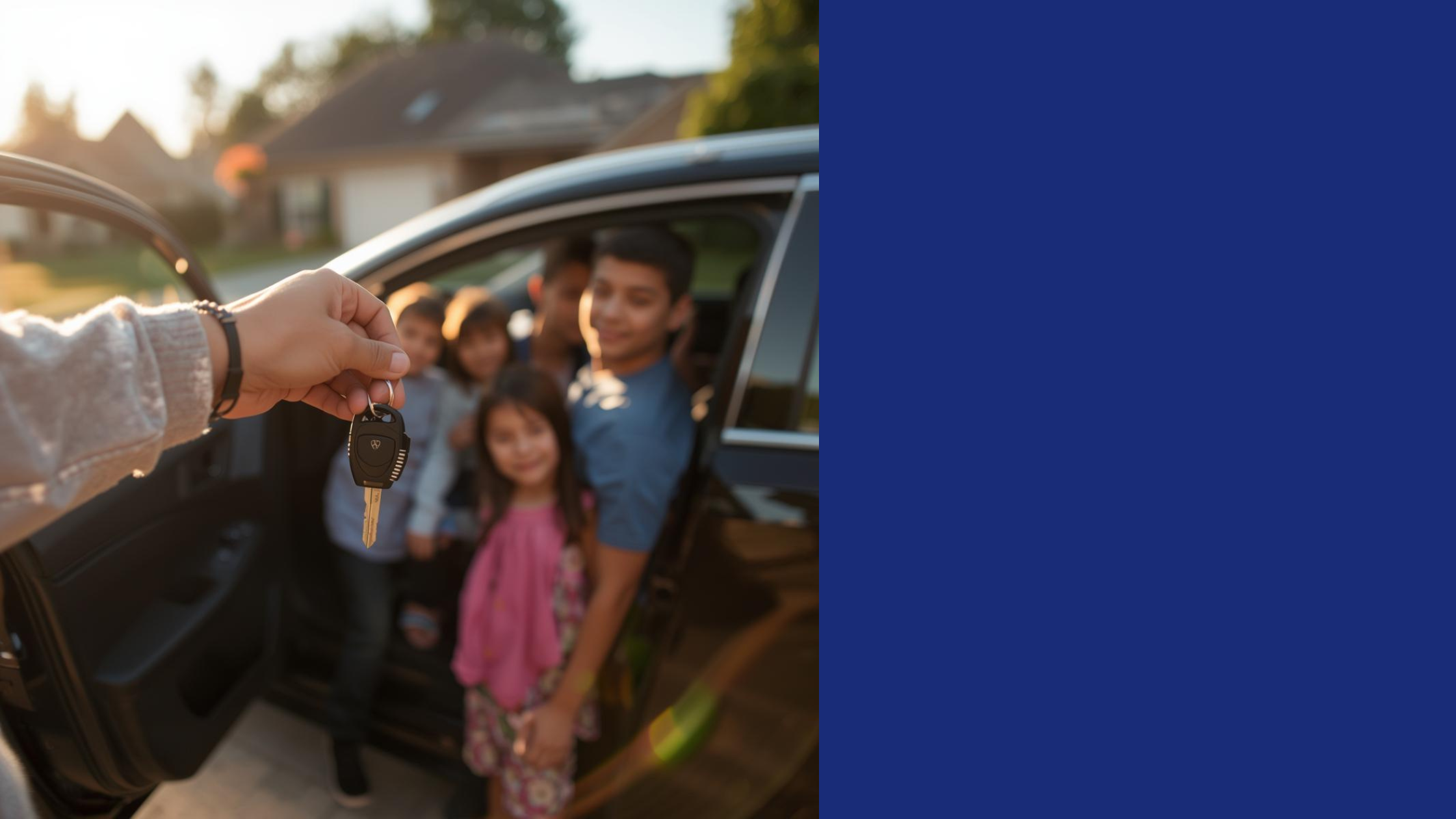 A person holding car keys out the window of a black car, giving them to a group of smiling children and a young man inside the car, with a suburban neighborhood in the background during sunset.