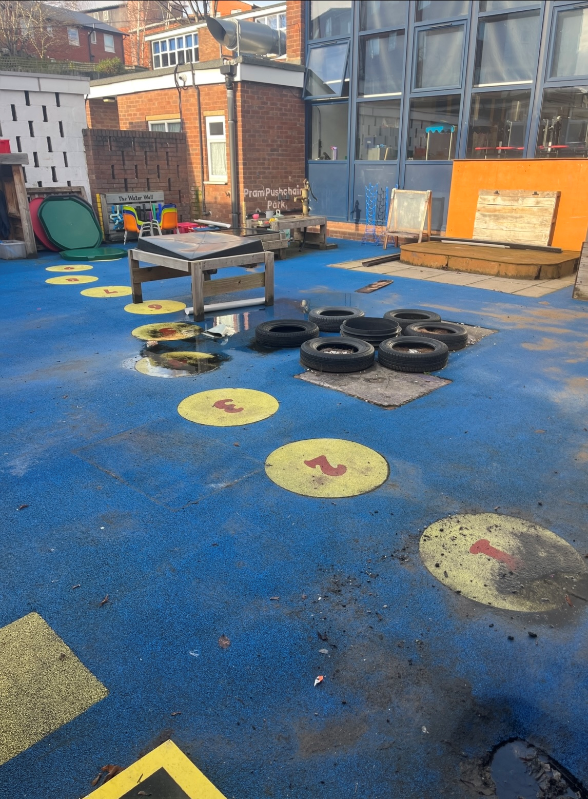 Photo of the concrete outfood space at St Catherine of Siena Catholic Primary School (Nursery) before the transformation of the space into The Nest.