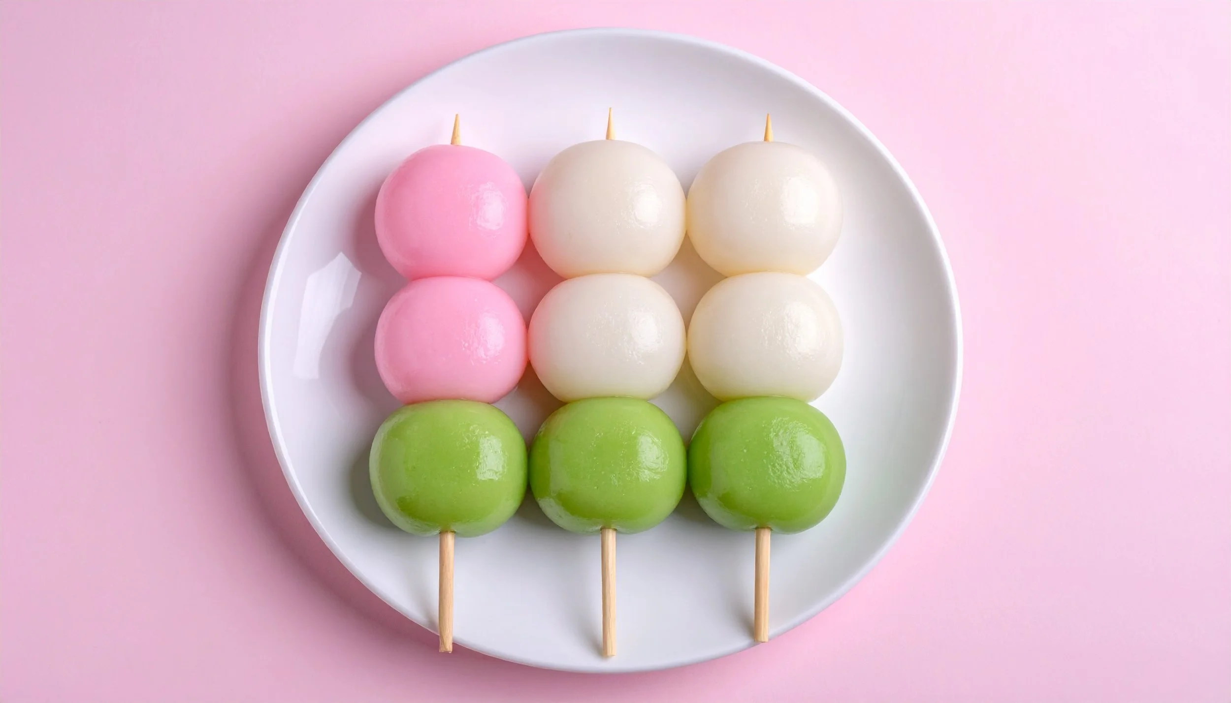 vecteezy_delicious-dango-skewers-a-colorful-japanese-treat-on-a-plate_73483594.jpg
