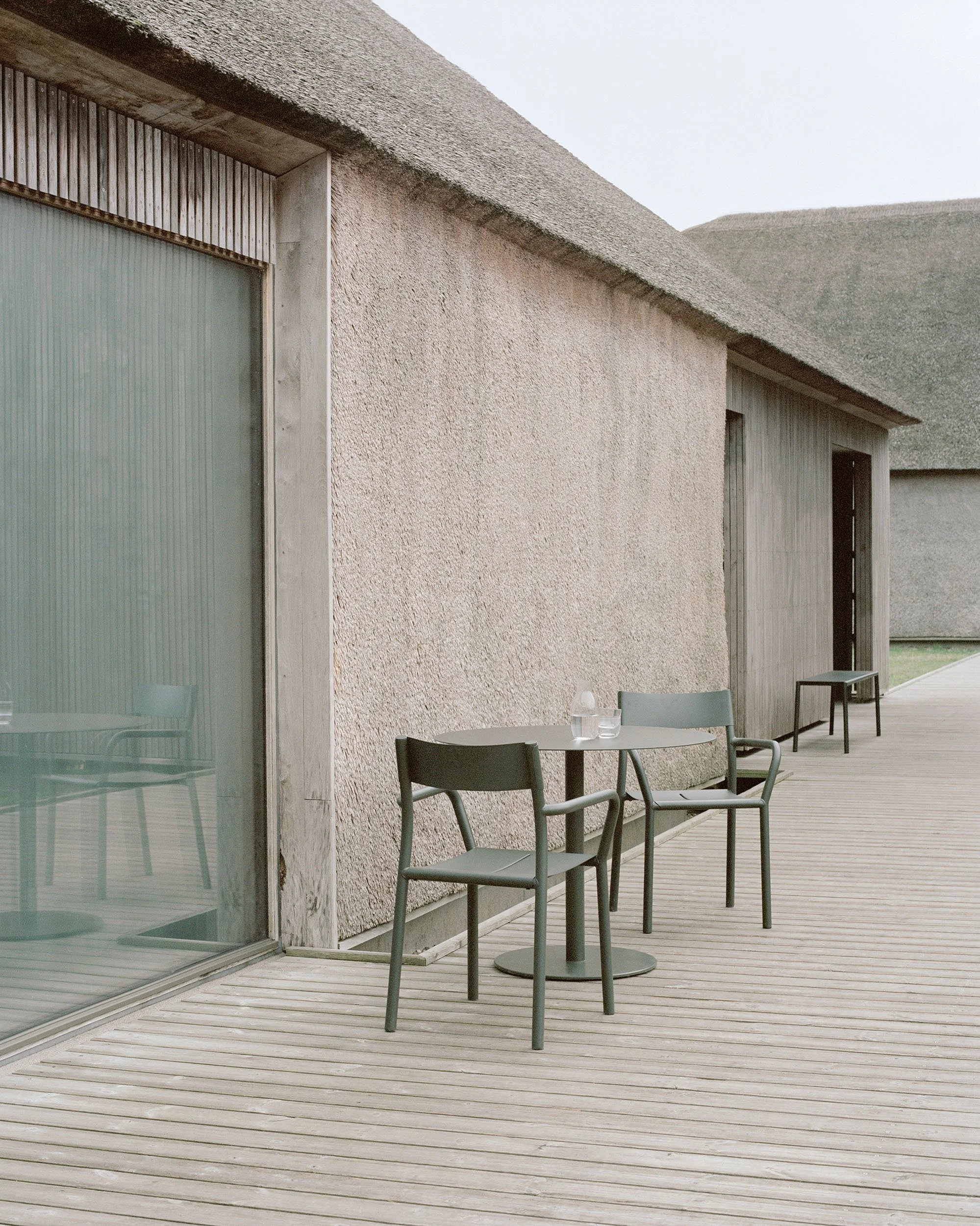 New-Works_Lifestyle_West-Coast_43230_42520_May-Bistro-Table-Round_May-Armchair_Dark-Green_2.jpeg