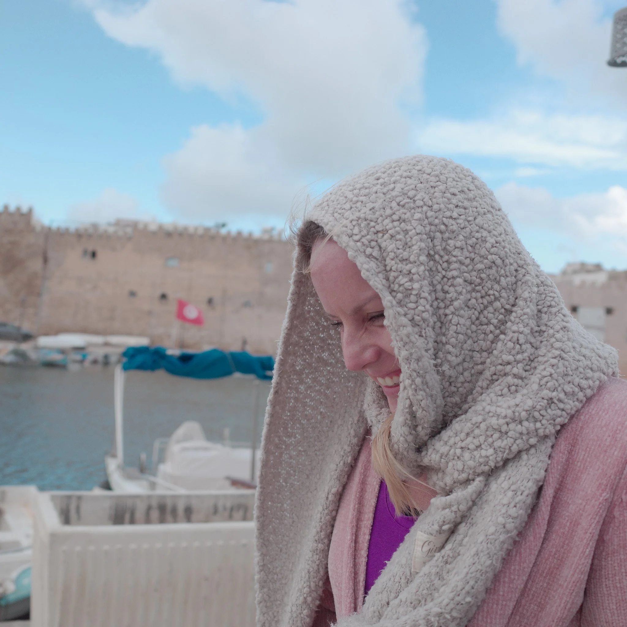 Covering her hair because of the rain - Photographed with Ricoh GR III and Film Simulation