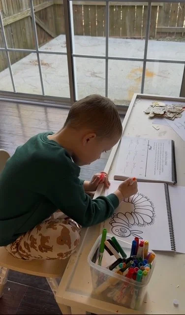 littles reading pic of tal coloring hungry caterpillar .JPEG