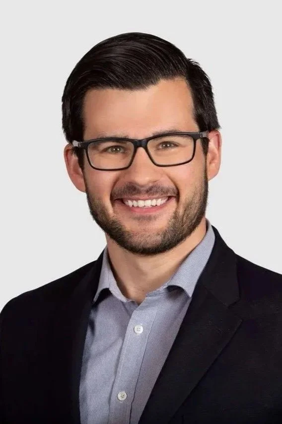 Man wearing a blue checkered suit and tie