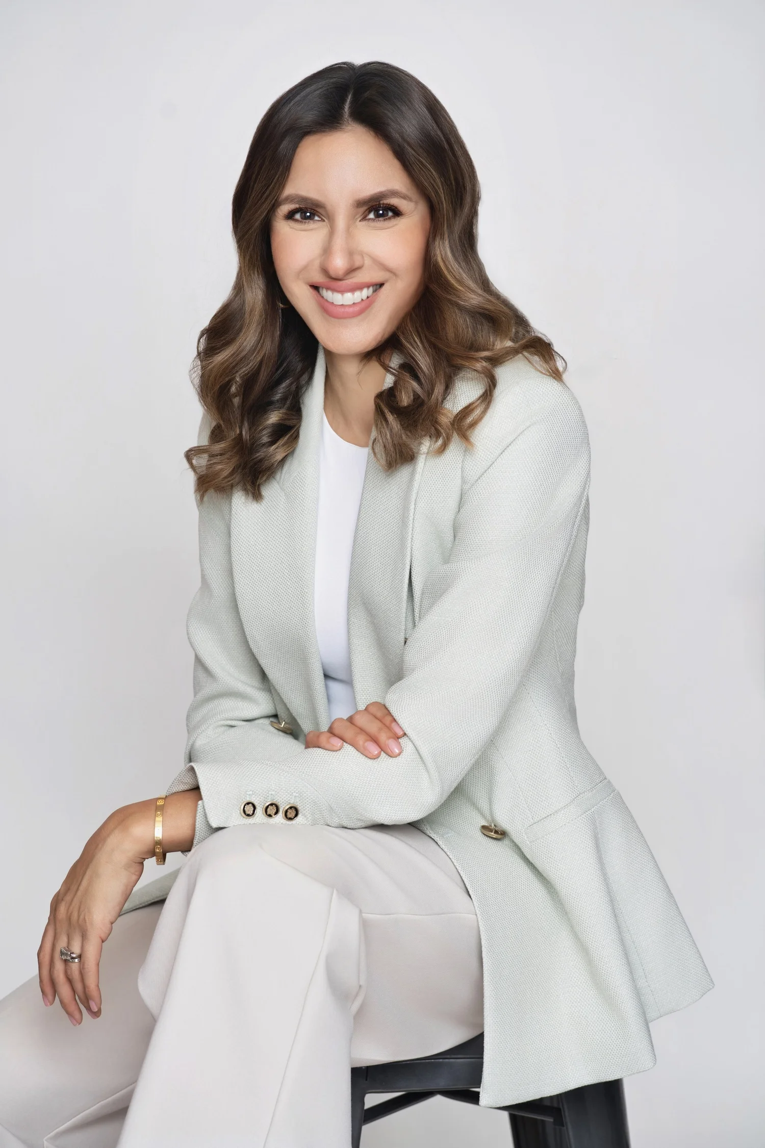 Professional portrait of a woman in a light suit
