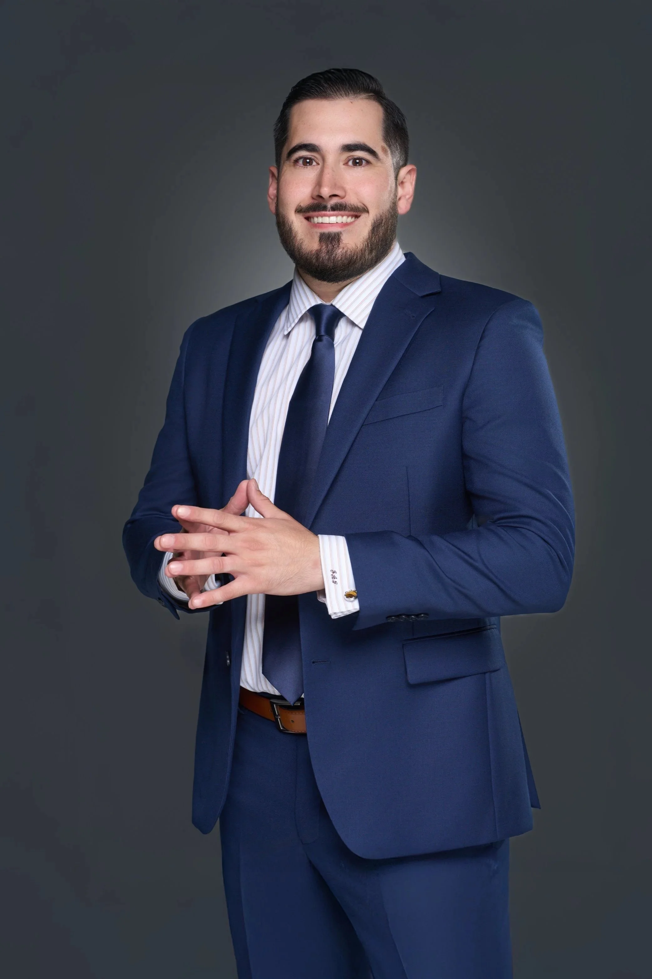 Man wearing a blue checkered suit and tie