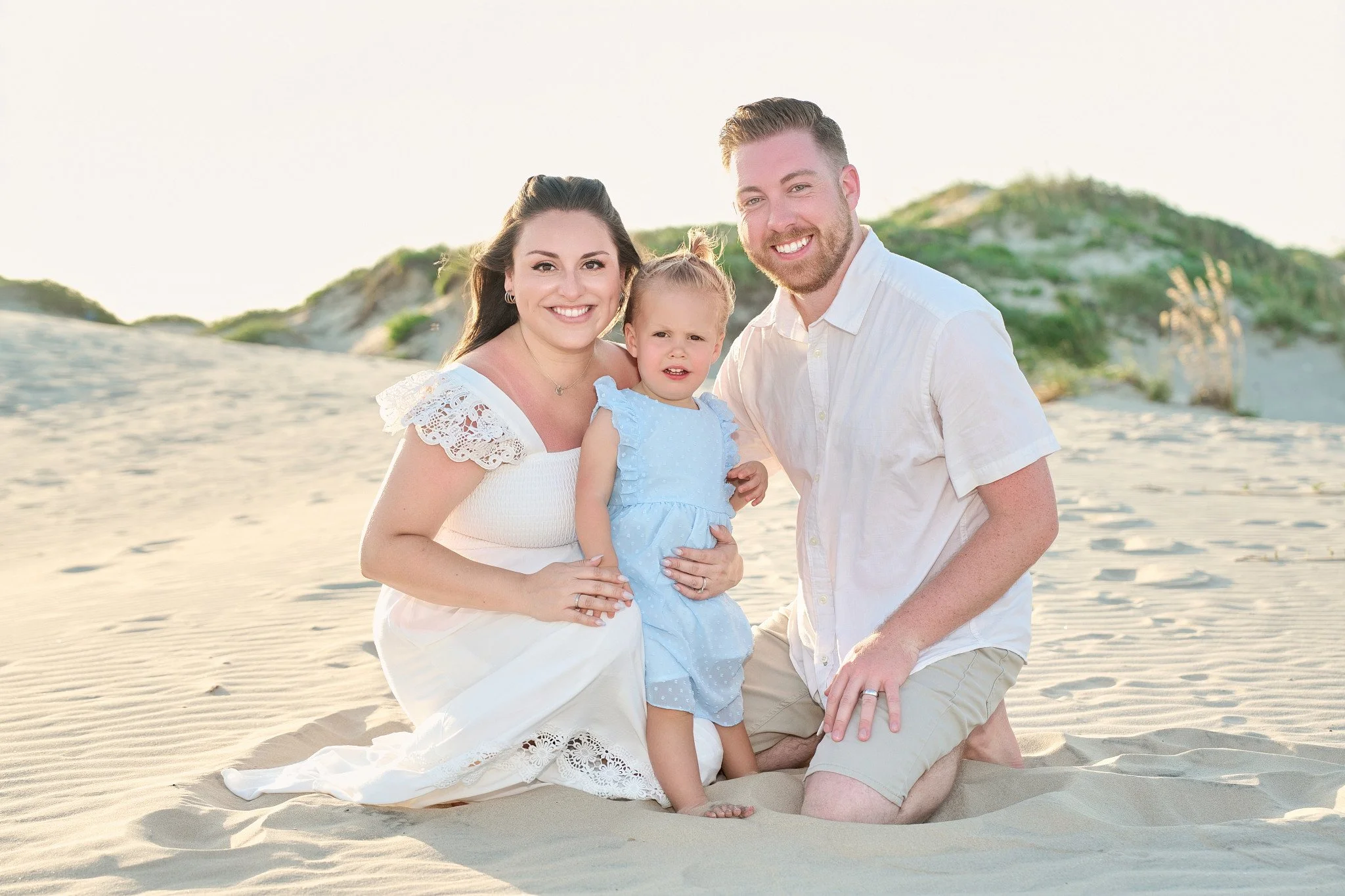 Family portrait photographed in the South Padre Island sand dunes by 956 Photography