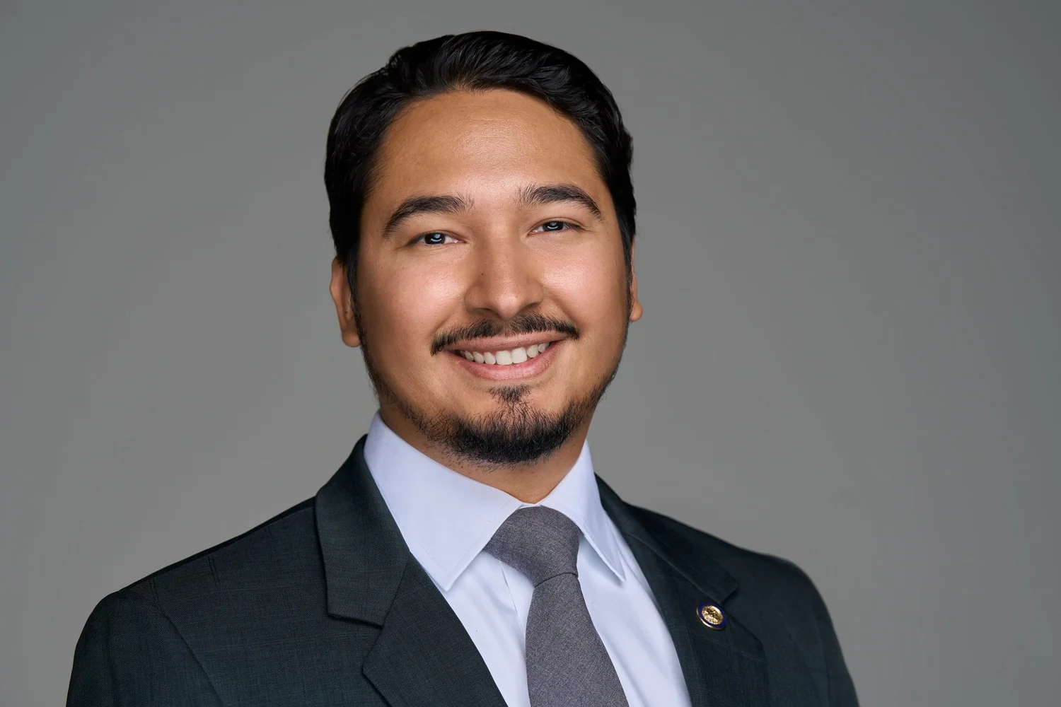 Attorney headshot on a gray background