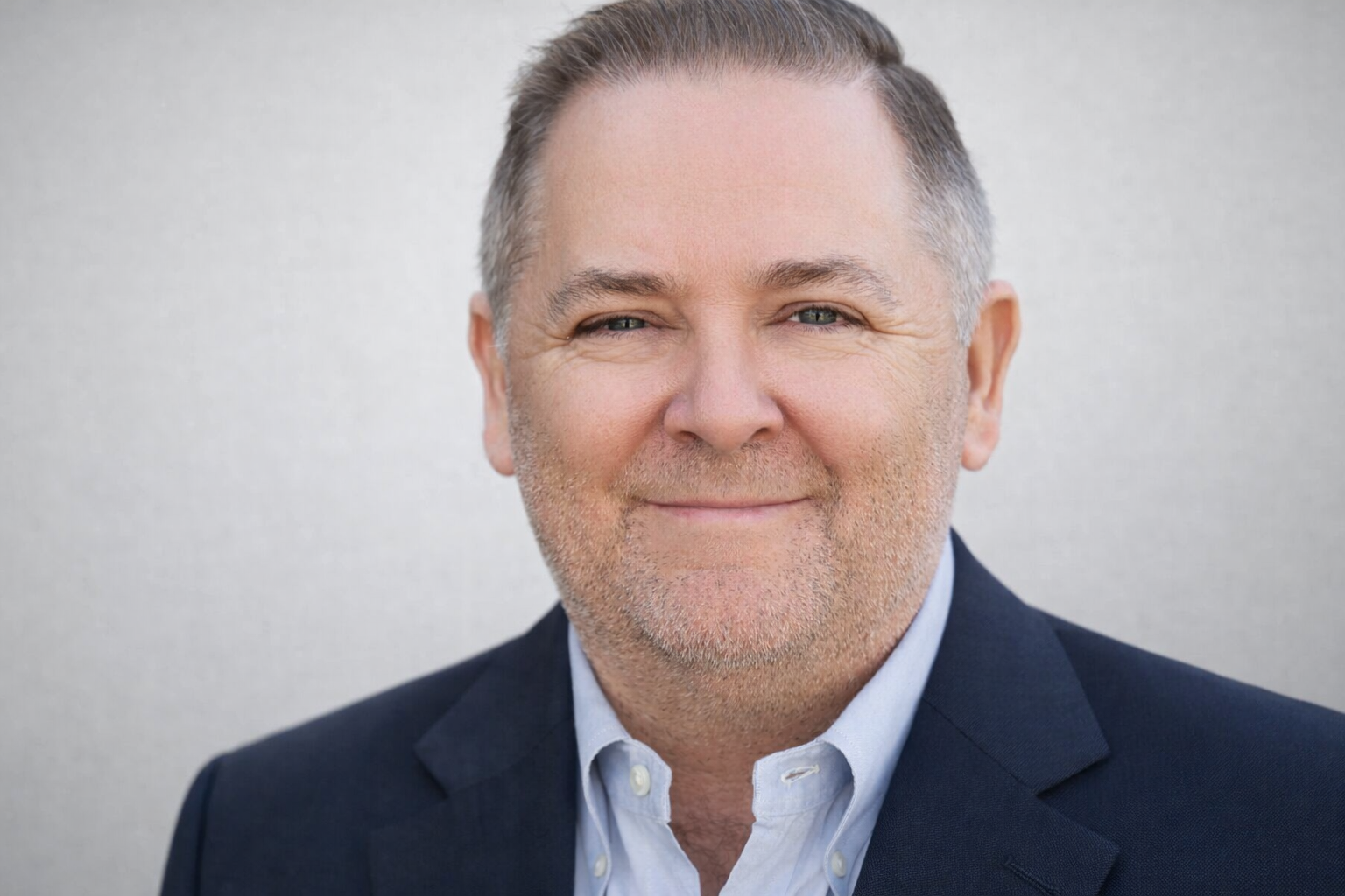 Confident smile in professional attire.png