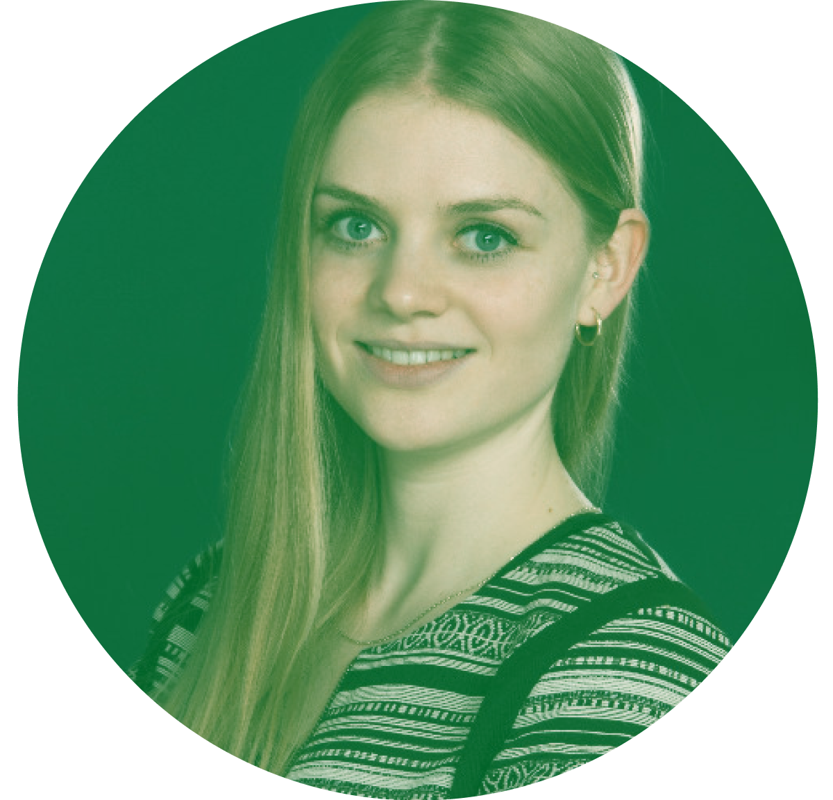 Portrait of a person with long hair wearing a patterned top, against a green background.