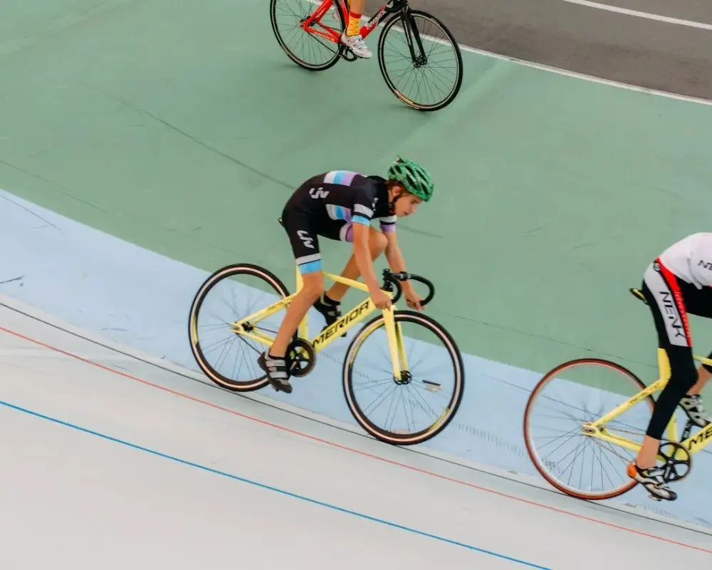 Track cyclists on a velodrome, seen from above