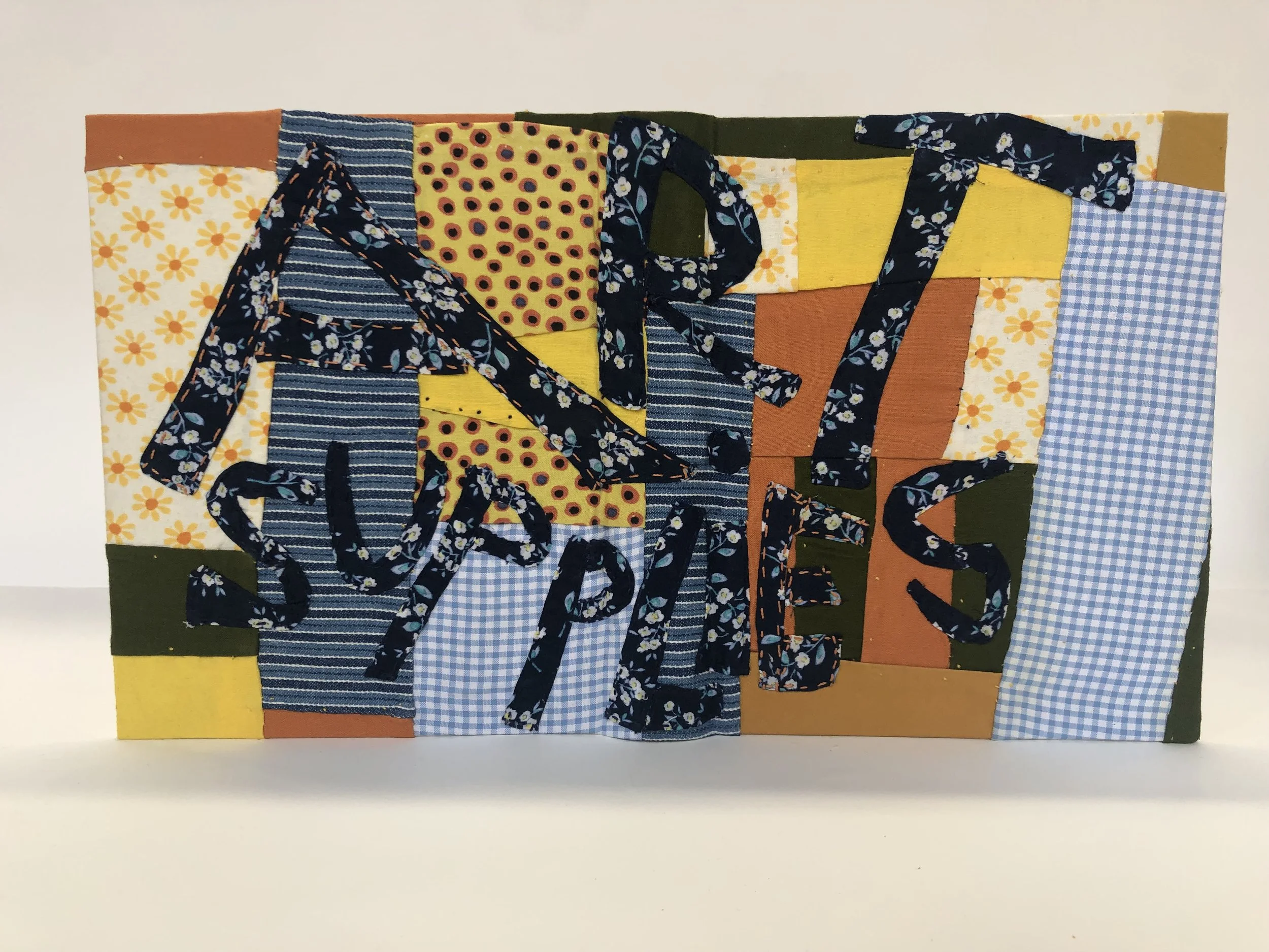 Art Supplies, bound in split-board binding and covered with hand pieced and appliqued "quilt top" cover.