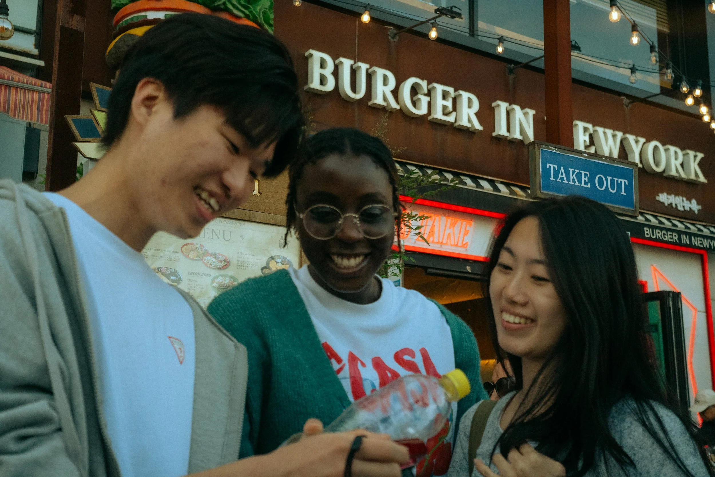 A picture of three people laughing