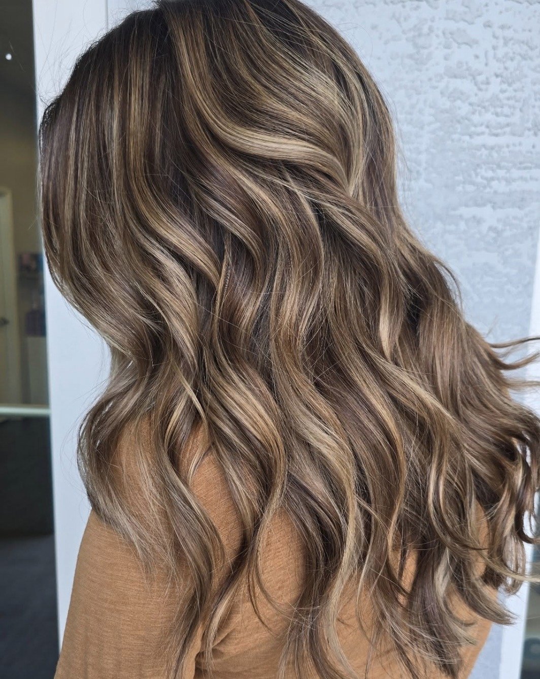 brunette with low lights beach waves 