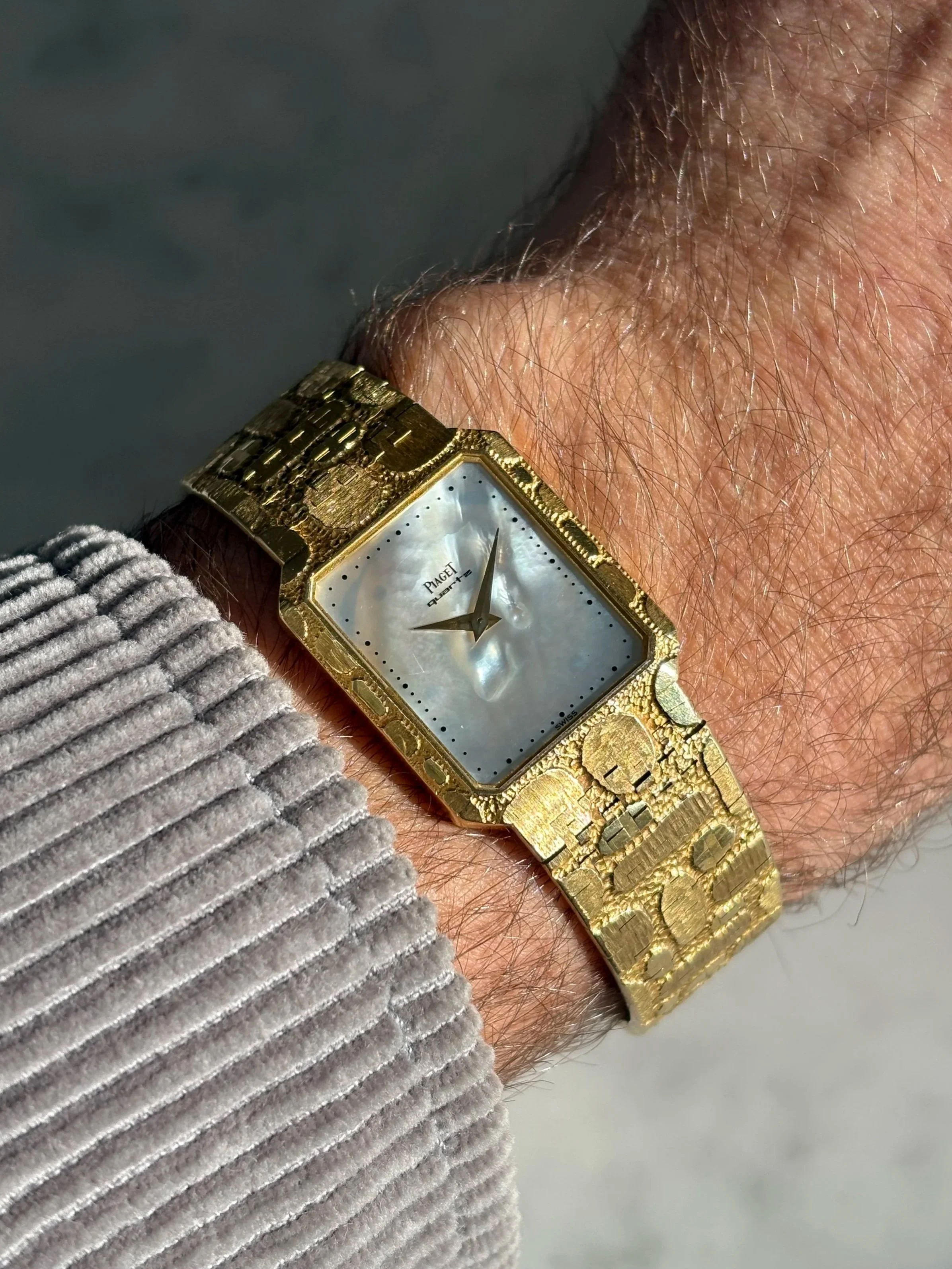 Piaget Tank Yellow Gold Pebble Tectured Bracelet & Mother Of Pearl Stone Dial ref. 7141