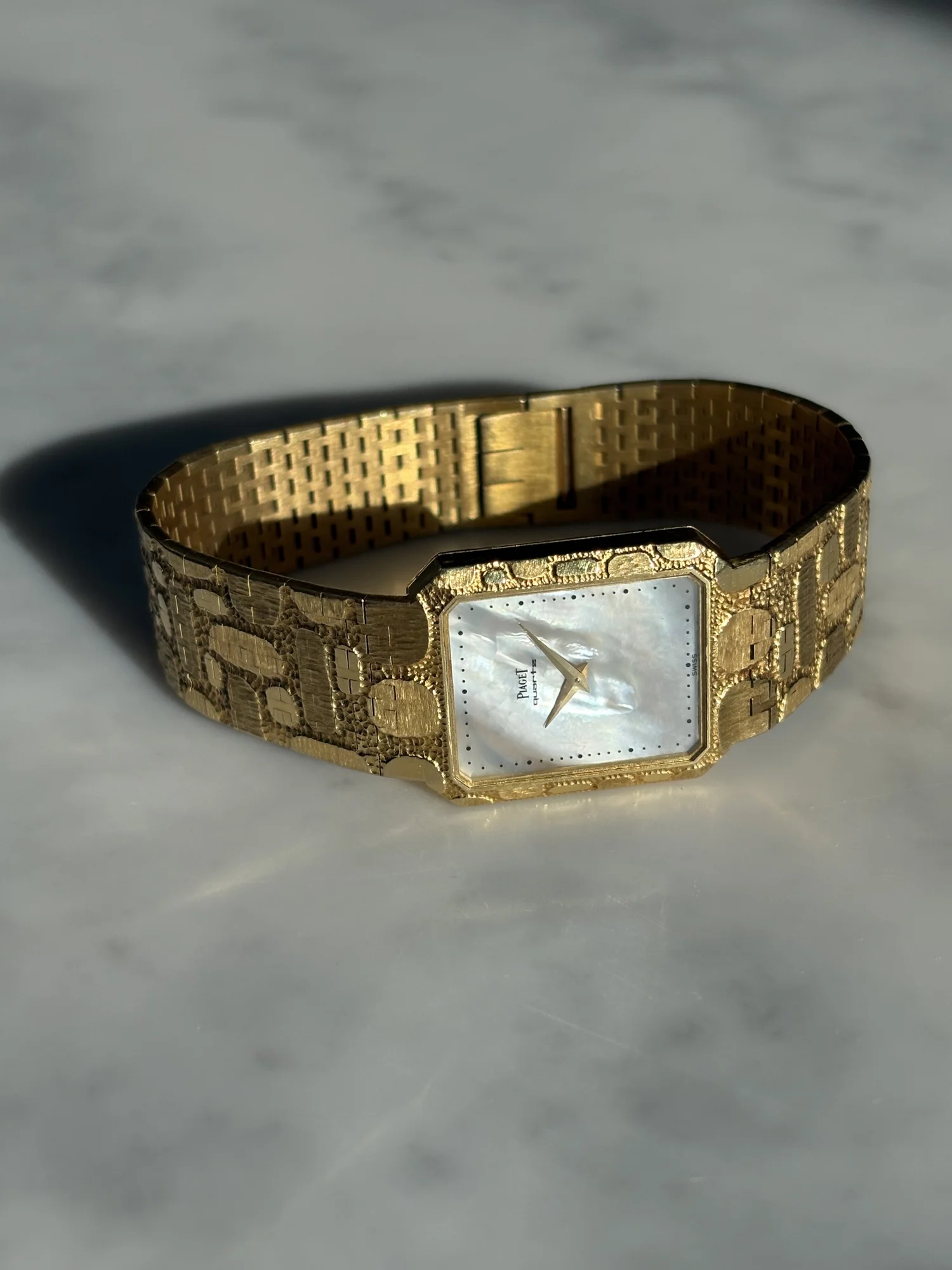 Piaget Tank Yellow Gold Pebble Tectured Bracelet & Mother Of Pearl