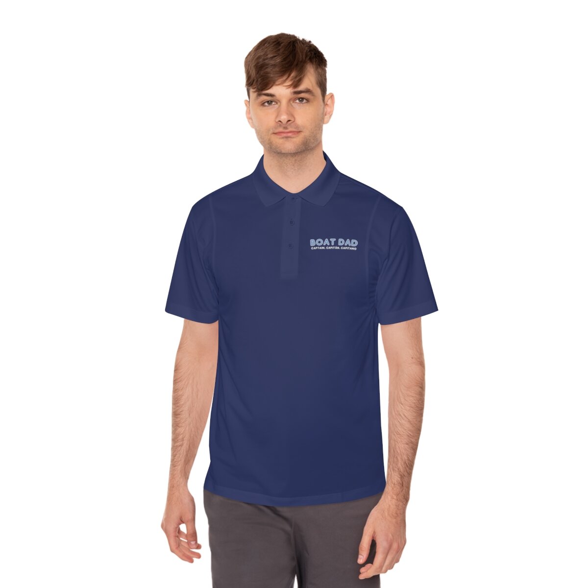dark grey polo shirt folded with Boat Dad written on the front from Lake Life Shop online store