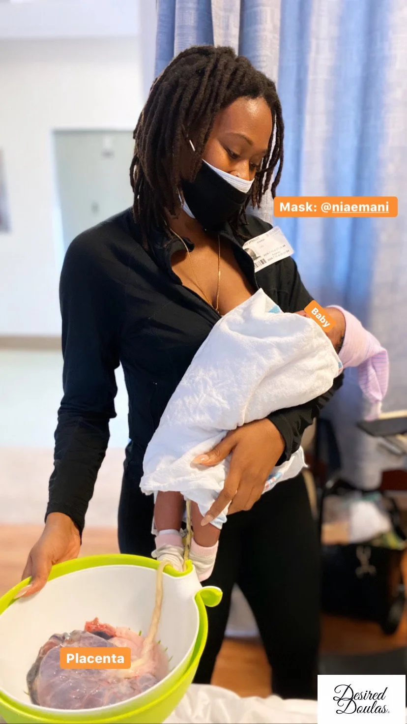 A woman wearing a mask holds a newborn wrapped in a blanket. She also holds a colander containing a placenta connected to the baby by the umbilical cord. The image is tagged with text indicating the baby's and placenta's labeling."