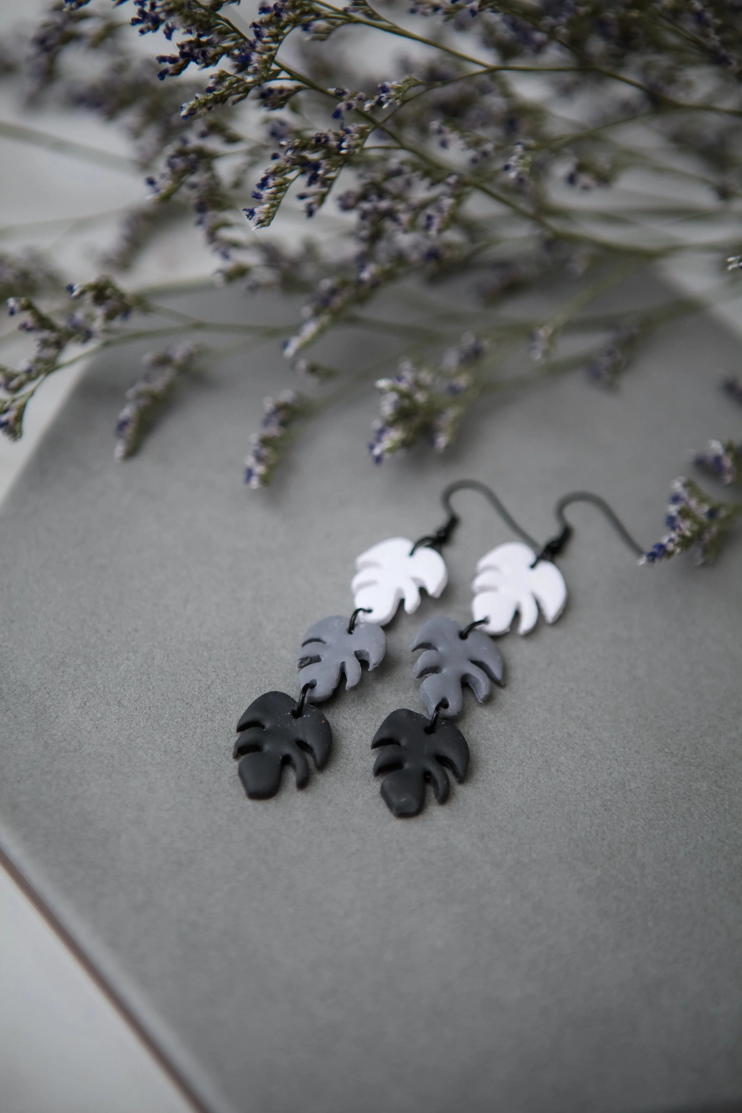 monochrome monstera dangles black hooks.jpg