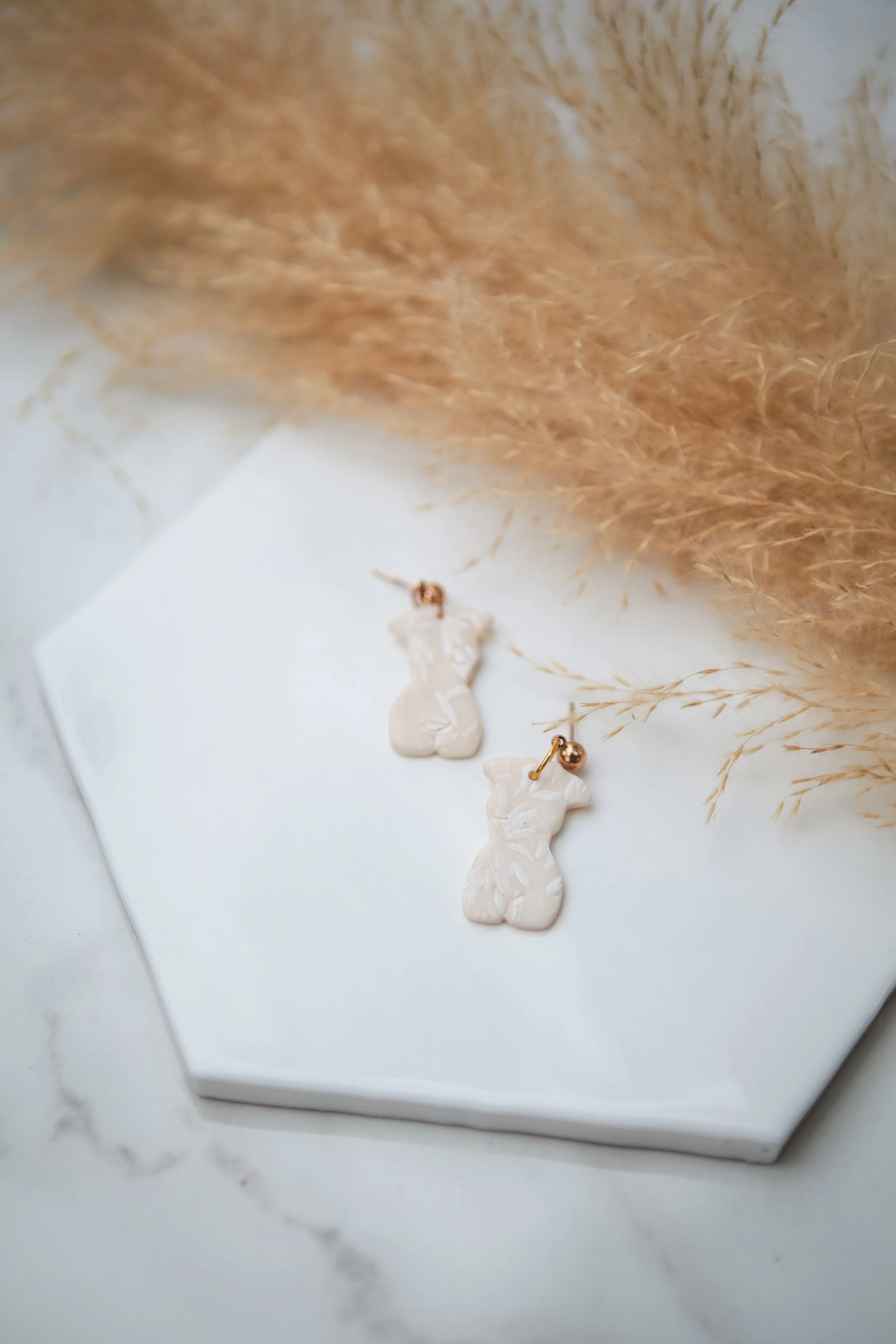 translucent women leaf studs.jpg