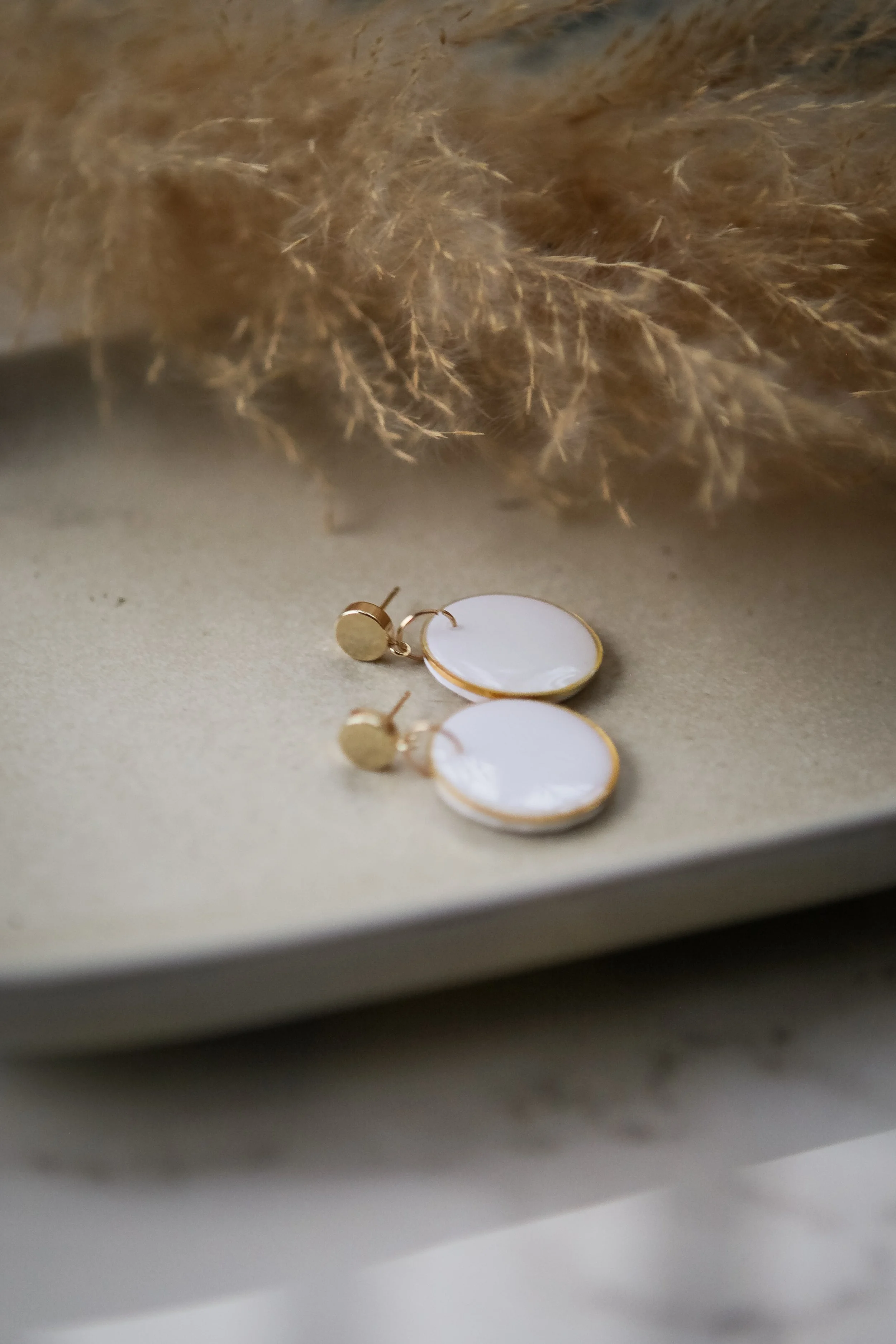 white circle gold bezel gold stud.jpg