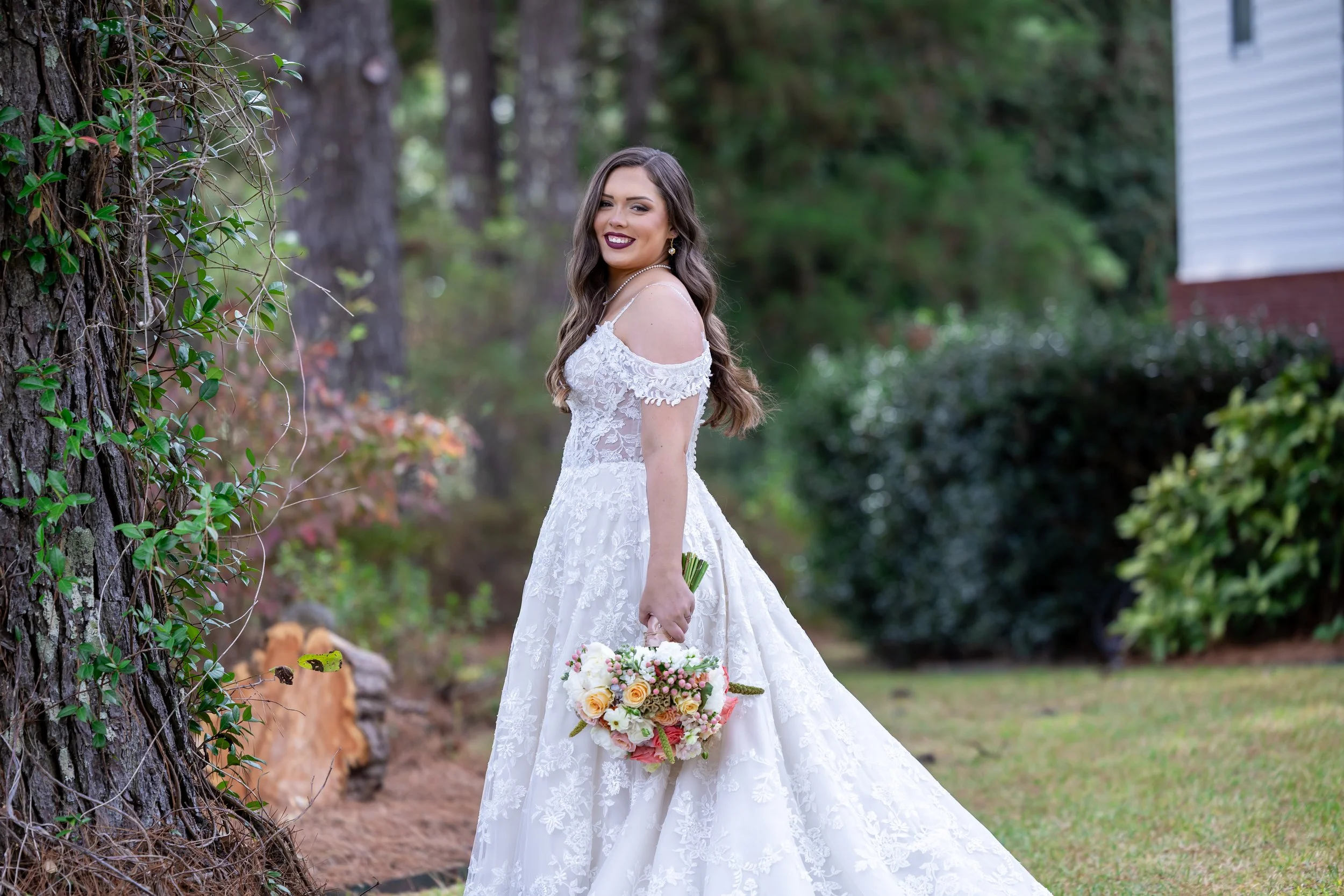 Silver high heel shoes decorated with rhinestones and a diamond ring on the toe of the front shoe.