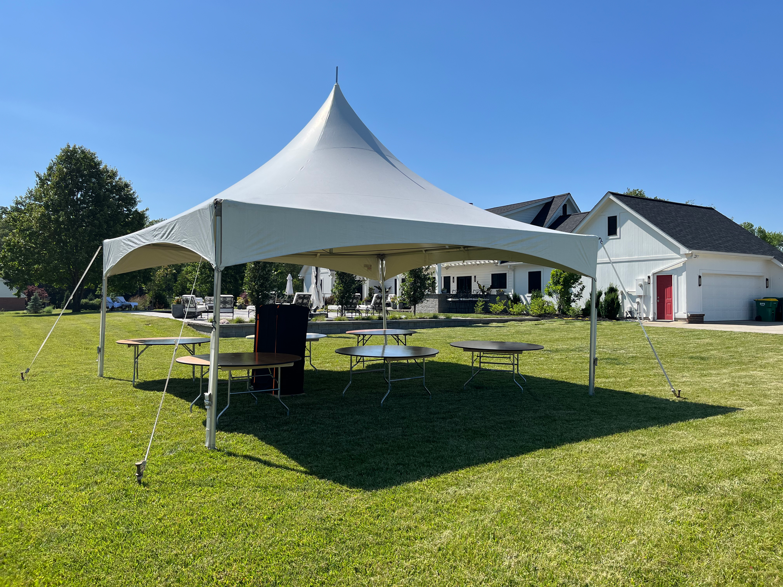 20x20 high peak frame tent setup in Avalon of Fishers backyard for graduation party tent rental