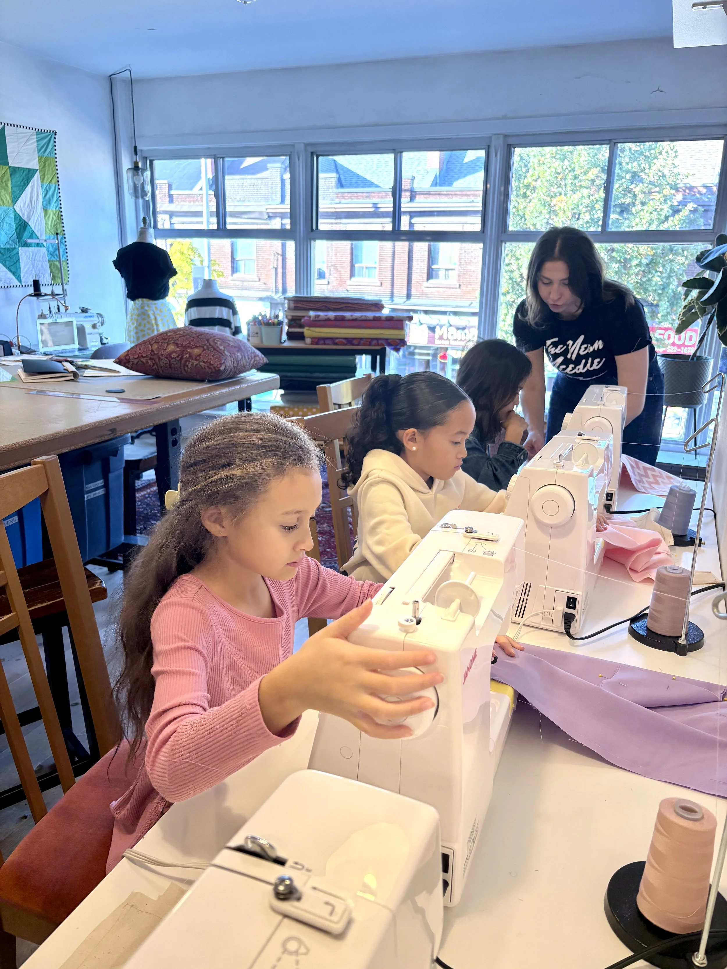 liz kids class, everyone is sewing pillows