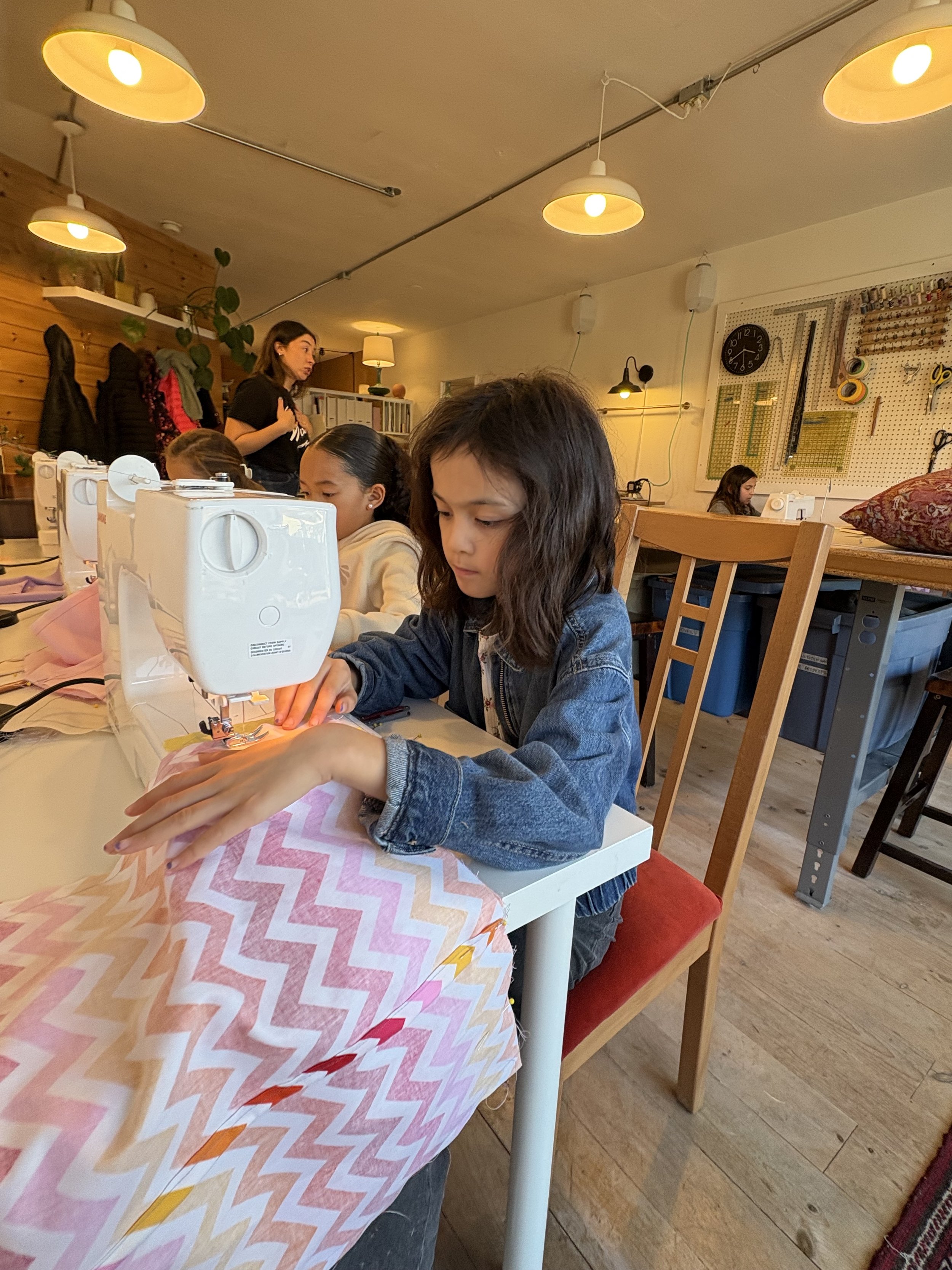 concentrating on sewing pillows