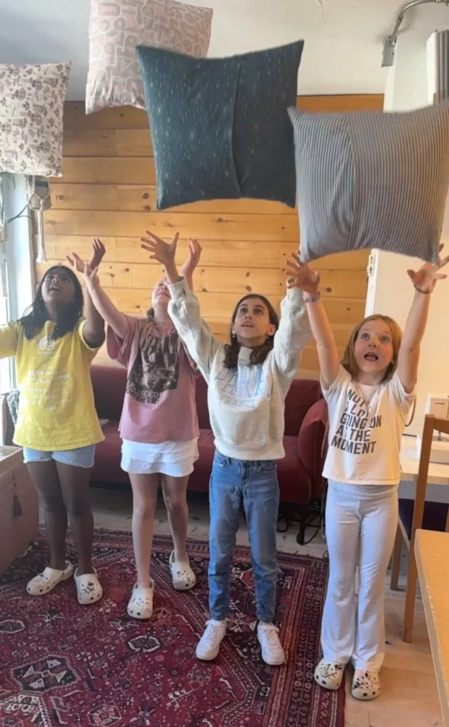 kids class tossing pillows they just made