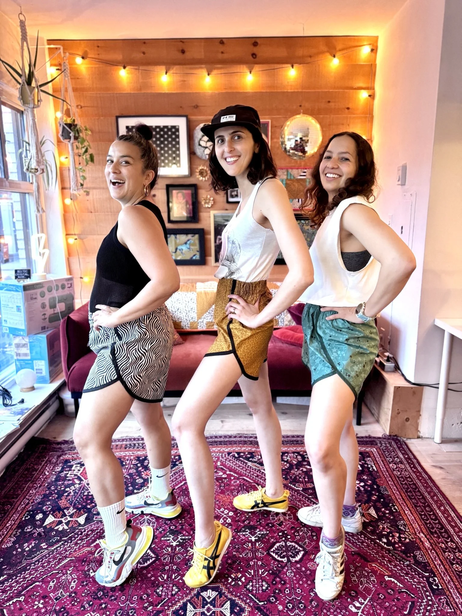 model is wearing the 80s gym shorts in a cheetah print with black binding