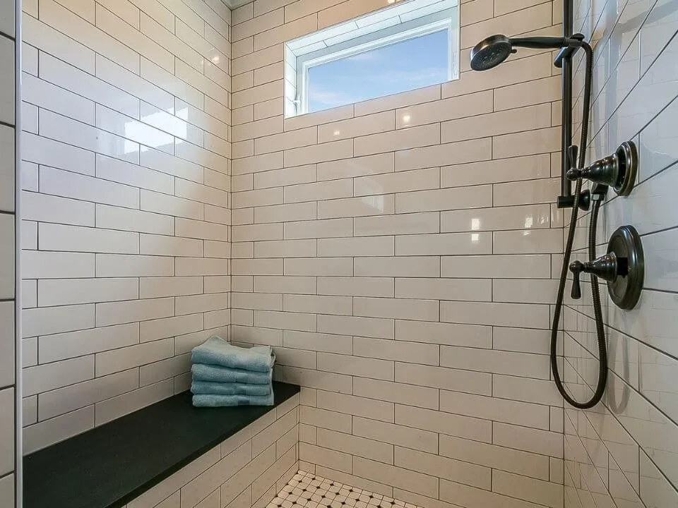 Beige Subway Tile & Bench Seating in the Shower