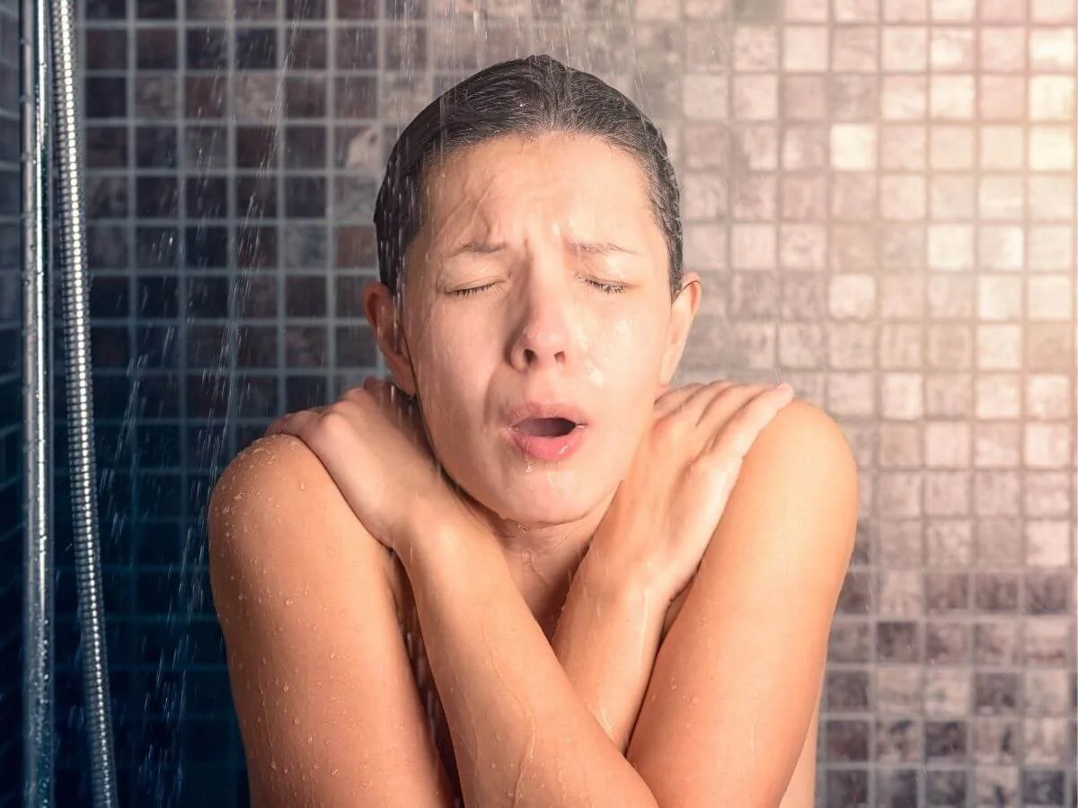 Woman Taking a Cold & Drafty Shower