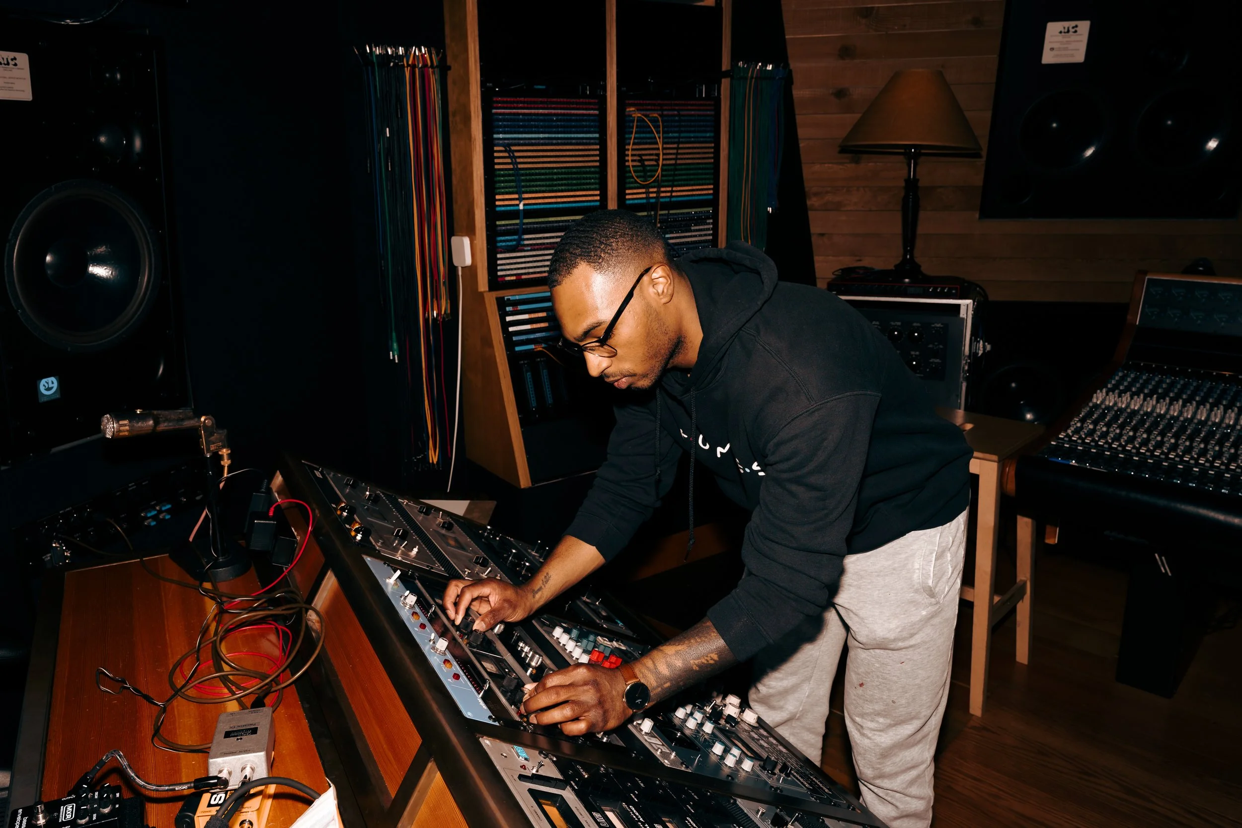 Laurie’s customers, Mariana and Carmen holding hands on a green lawn on their wedding day.