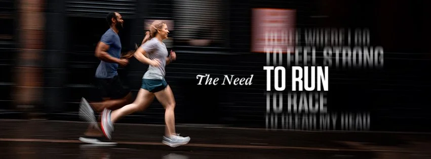 A man and woman running on a treadmill or track in an indoor gym with motivational text overlayed that says, "The Need To Run".