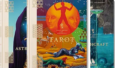 Collection of tarot and astrology books with colorful illustrated covers.