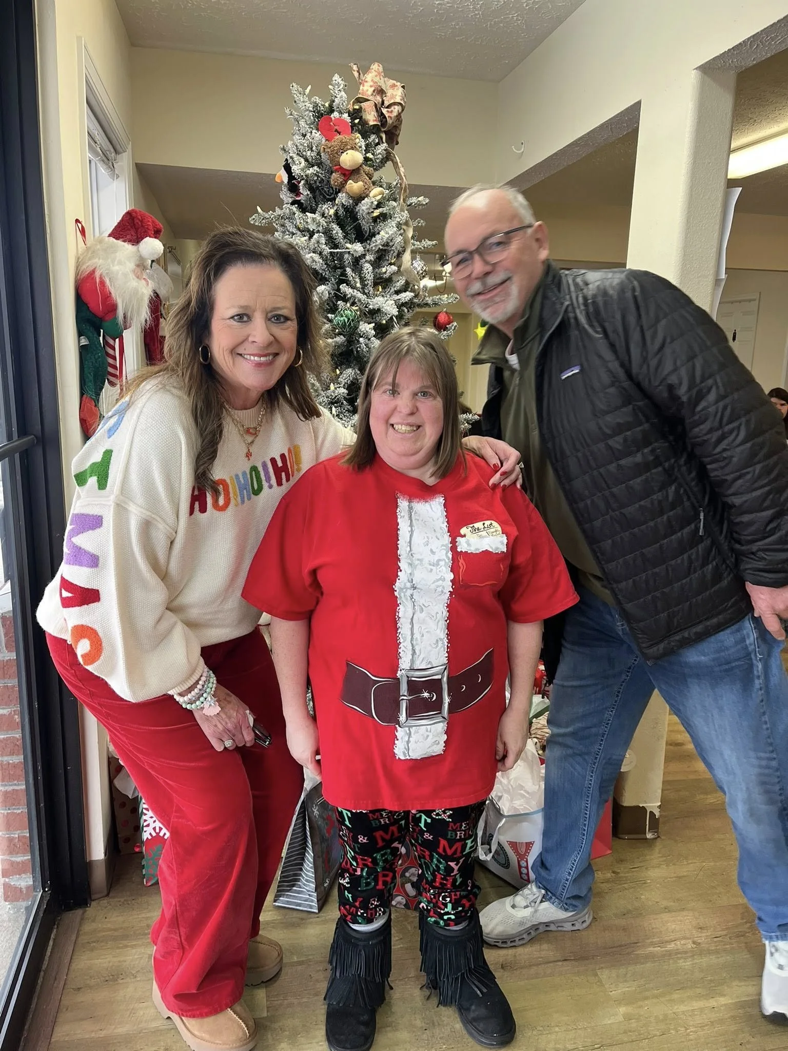 Adults 2026 KJ and Brad with girl.jpg