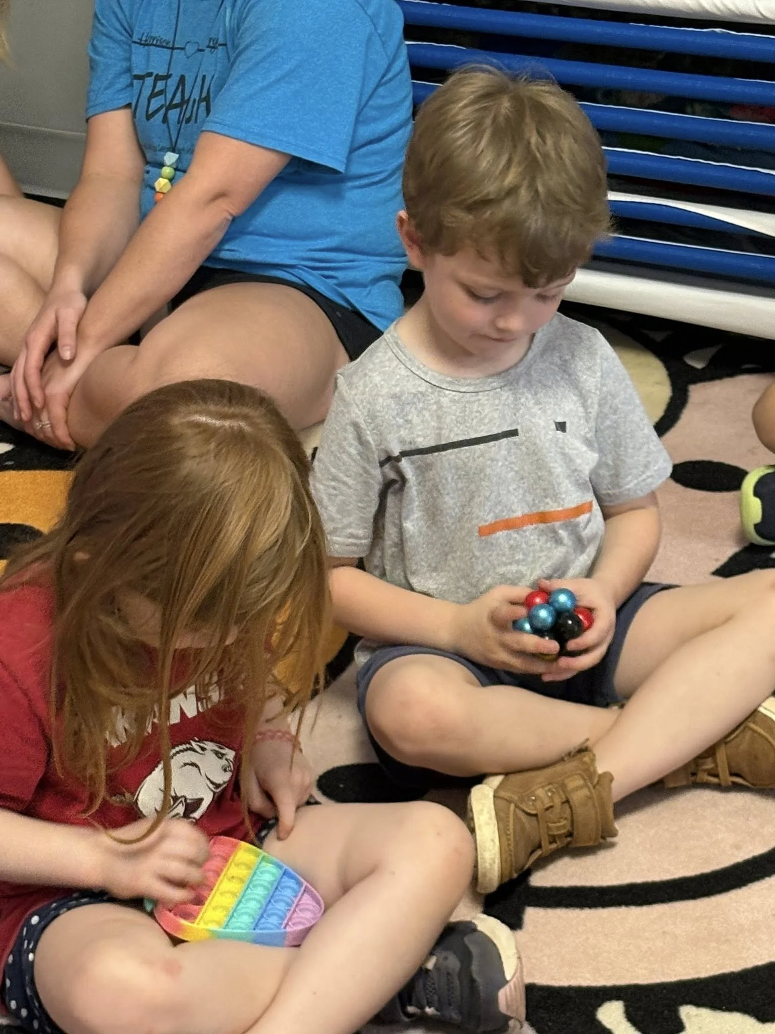Harrison boy and girl with fidget toys.jpg
