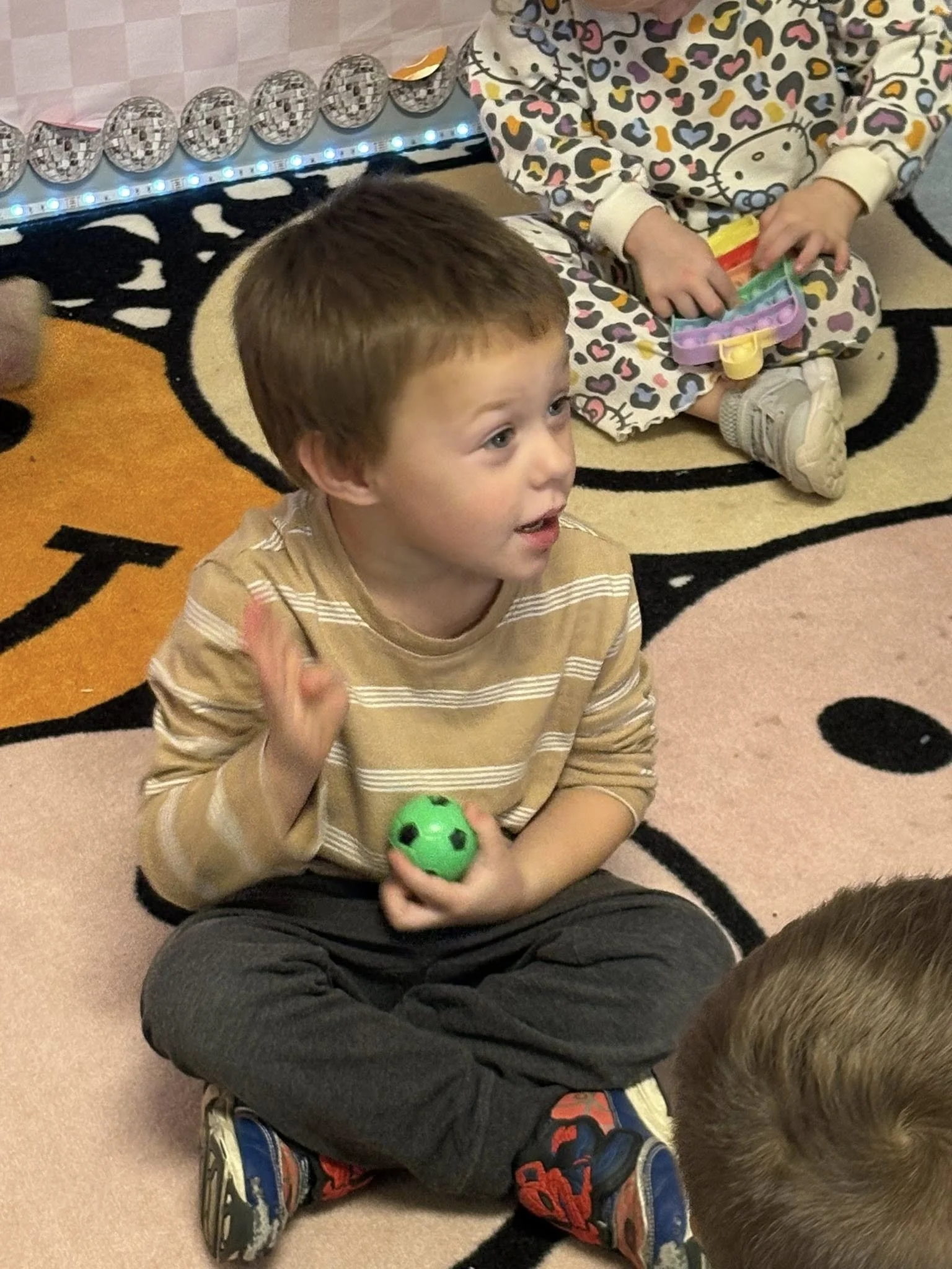 Harrison boy raising his hand.jpg