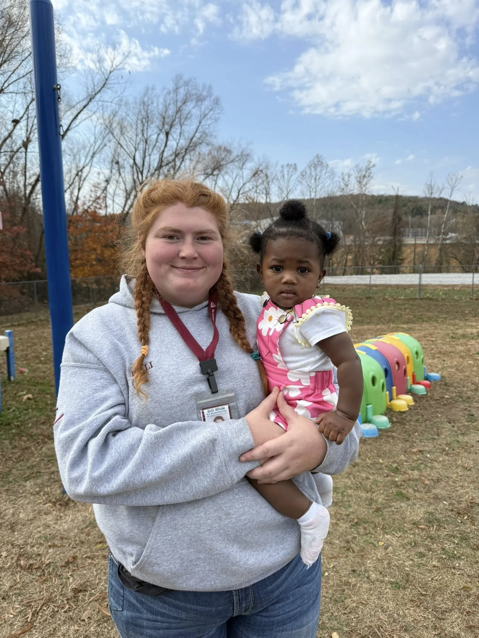 Huntsville teacher holding child.jpg