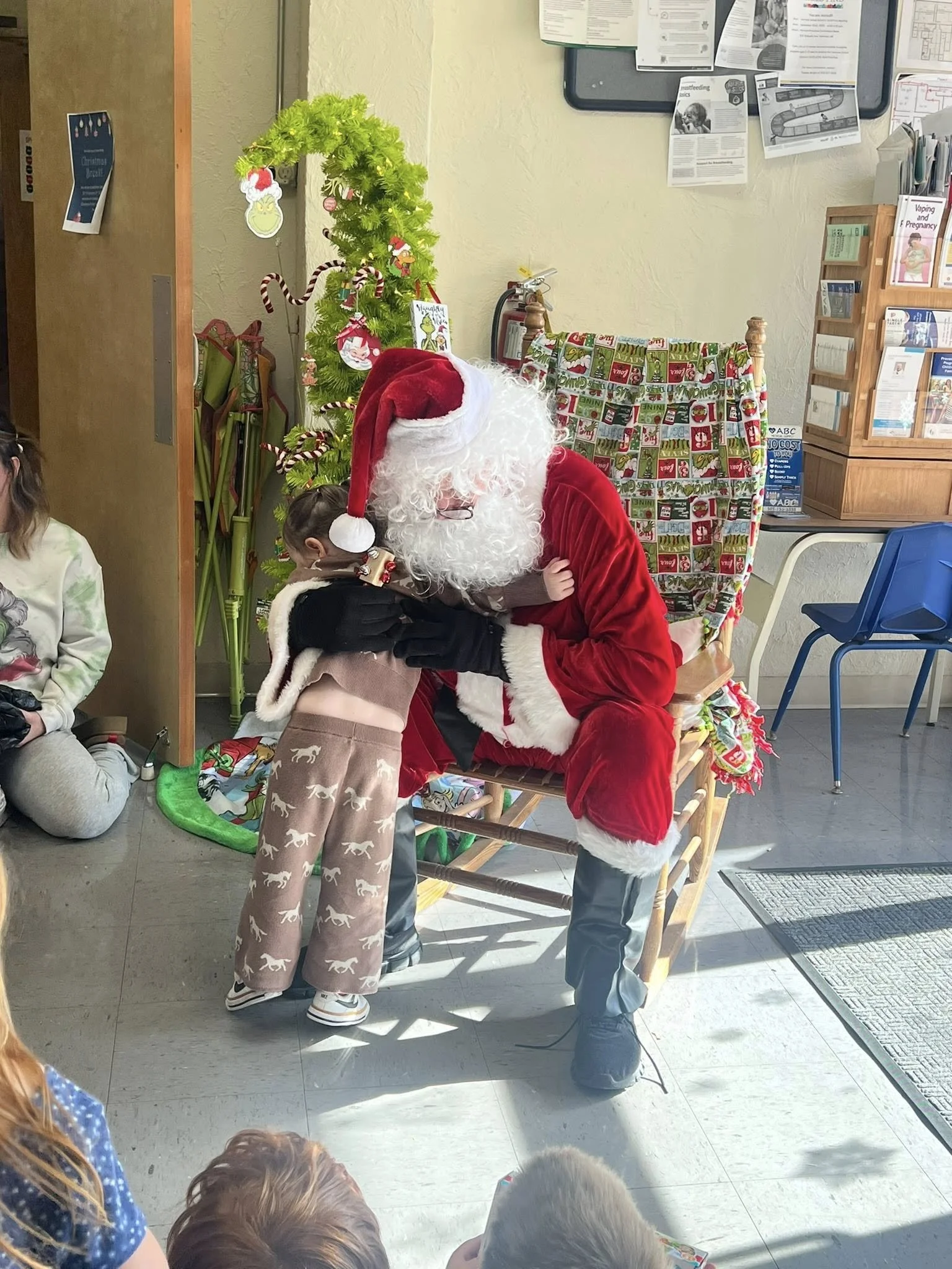 HSN 2026 Jan Santa getting hug.jpg