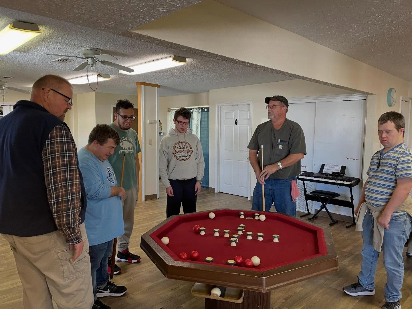 Adults and Rodney playing pool.jpg
