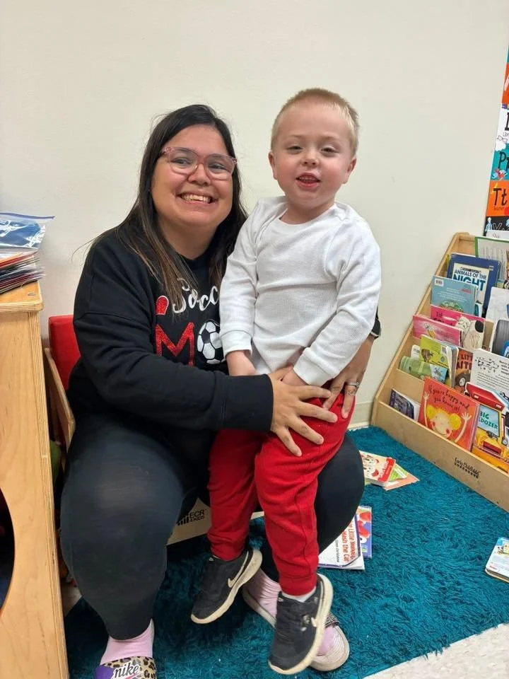 BV 2026 January teacher holding student.jpg