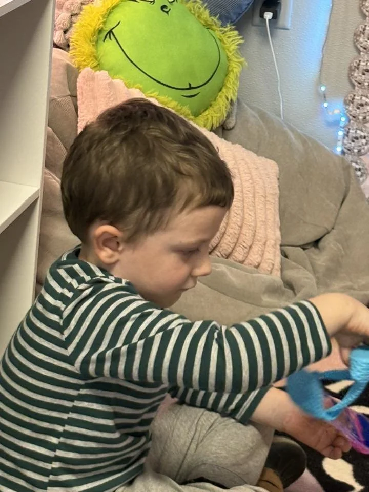 Harrison boy with fidget.jpg