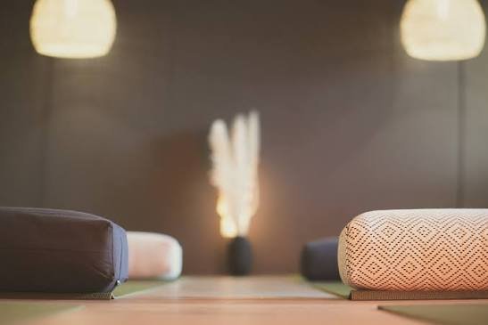 yoga mats in a warm cozy studio
