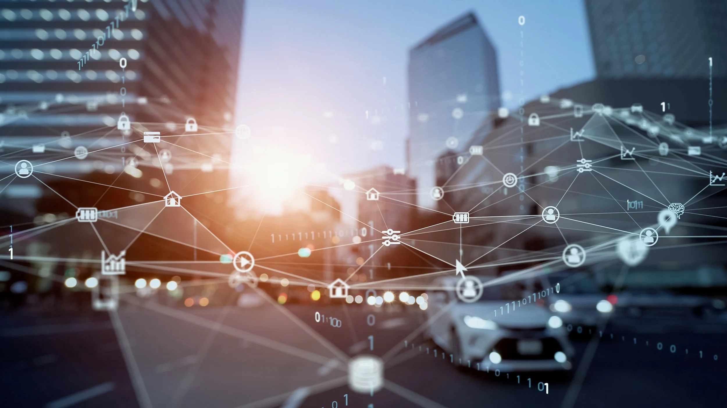 Interconnected telematics data nodes superimposed atop busy city intersection.